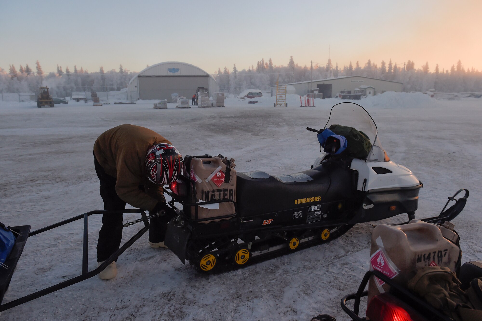 JOINT BASE ELMENDORF-RICHARDSON, Alaska -- U.S. Marines assigned to Delta Company, 4th Law Enforcement Battalion, deliver toys to children living in remote villages of Alaska as part of the Toys for Tots program, Dec. 8. After traveling to a remote hub of villages via aircraft provided by the 144th Airlift Squadron, Alaska Air National Guard, the Marines travel to different villages on snow machines. This year three teams of Marines traveled to numerous villages in the vicinities of Kotzebue, Galena and McGrath. Toys for Tots is a program run by the United States Marine Corps Reserve with a goal of delivering, through a new toy at Christmas, a message of hope to less fortunate youngsters that will assist them in becoming responsible, productive and patriotic citizens. (U.S. Air Force photo/Alejandro Peña)  