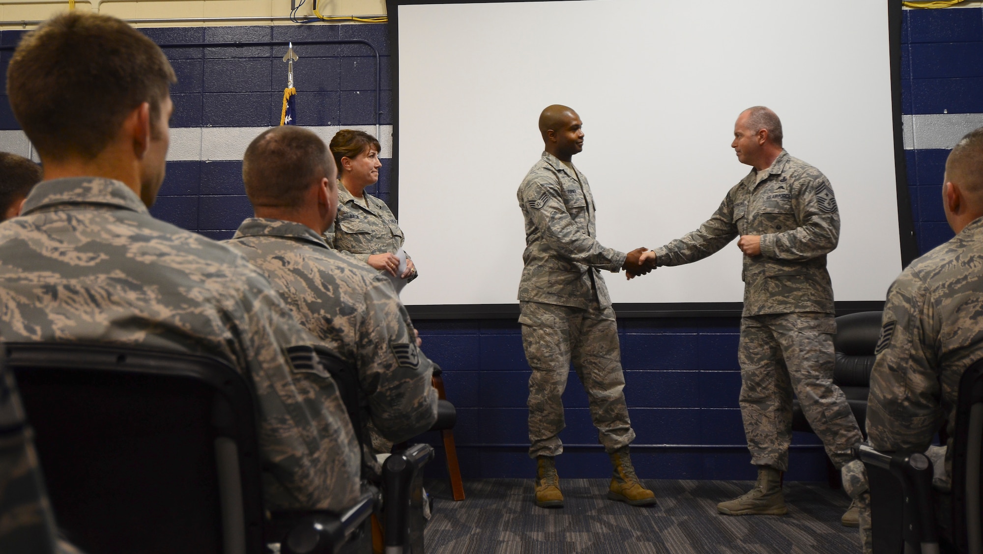 Chief Master Sgt. James W. Hotaling, command chief master sergeant of the Air National Guard, visited the 128th Air Refueling Wing at General Mitchell International Airport Dec. 5, 2015. During the visit Hotaling recognized Staff Sgt. Keith Turner, an Airman with the 128th Communications Flight, for outstanding service with the Rising Six Enlisted Council. (U.S. Air National Guard photo by Tech. Sgt. Meghan Skrepenski/Released)