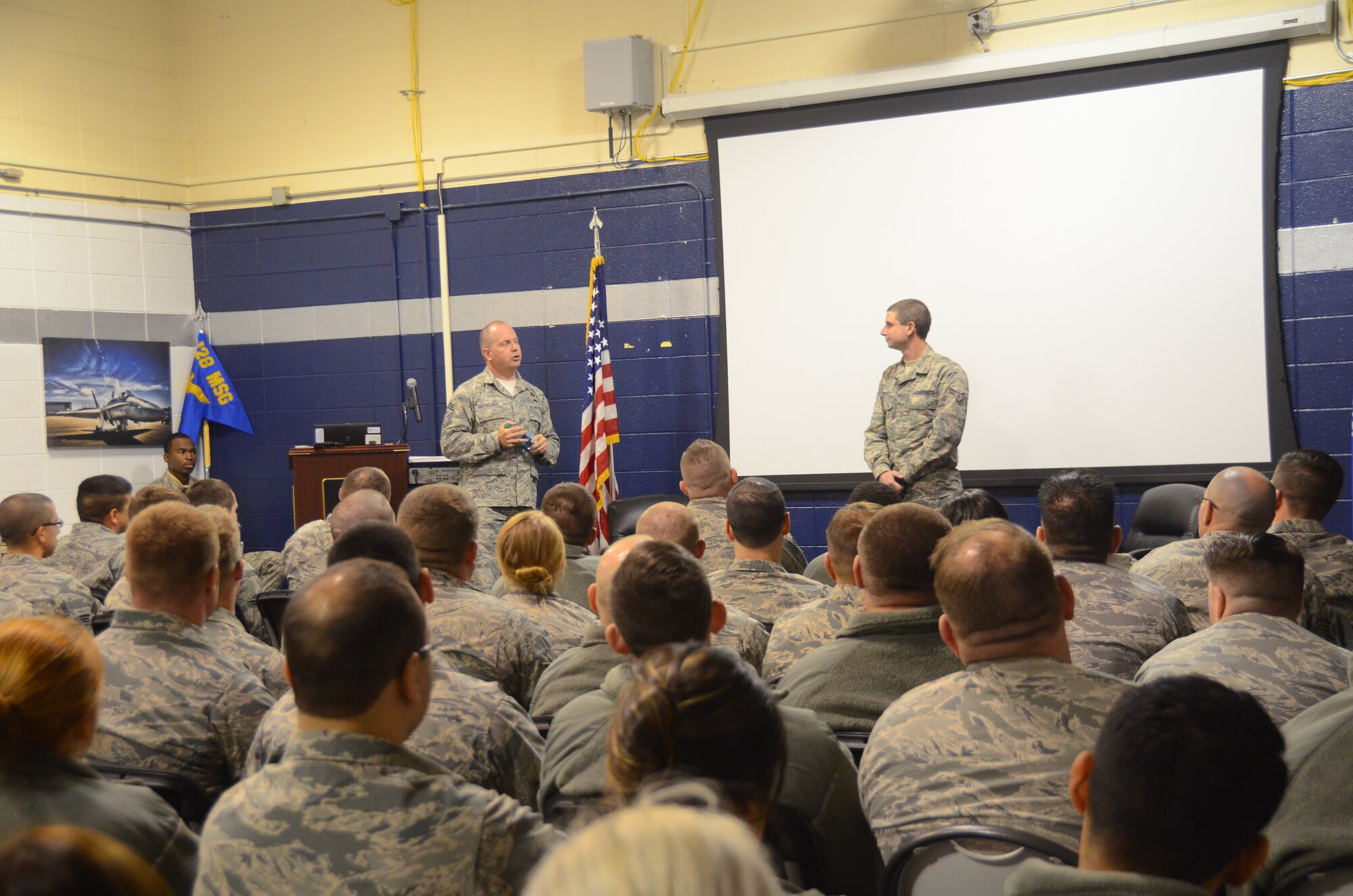 Chief Master Sgt. James W. Hotaling, command chief master sergeant of the Air National Guard, visited the 128th Air Refueling Wing at General Mitchell International Airport Dec. 5, 2015. During the visit Hotaling discussed the importance of the commitment to the profession of arms with the help of Senior Airman Ryan Peters, a logistics apprentice with the 128 ARW. (U.S. Air National Guard photo by Tech. Sgt. Meghan Skrepenski/Released)