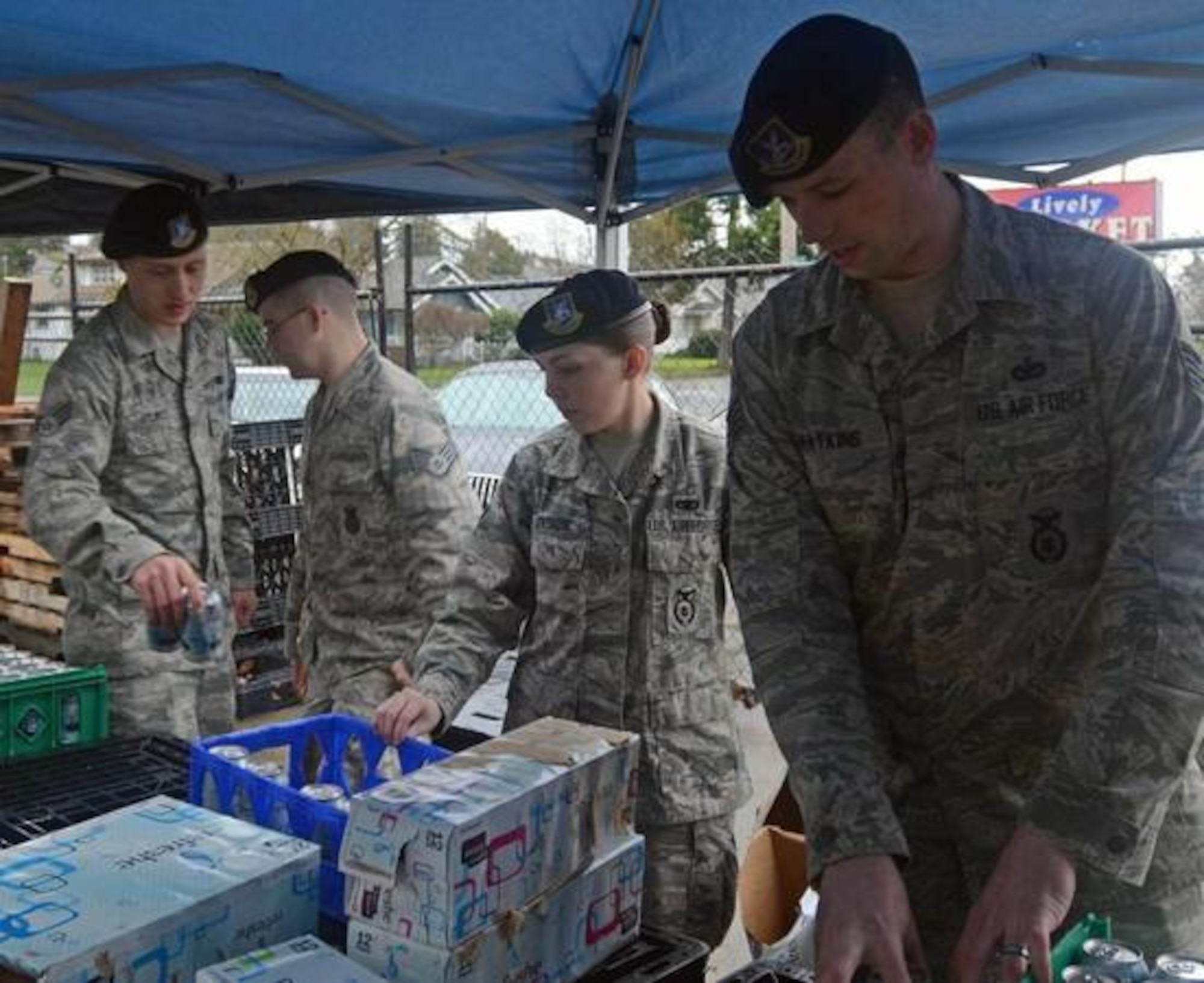 Staff Sgt. Daniel Watkins, right, 627th Security Forces Squadron’s base defense operations controller, and Airmen from his unit help sort food at the Empowerment Center Dec. 5 in Tacoma. Watkins regularly volunteers for the Empowerment Center to help provide food to the local community.(U.S. Air Force Photo/Senior Airman Jacob Jimenez)
