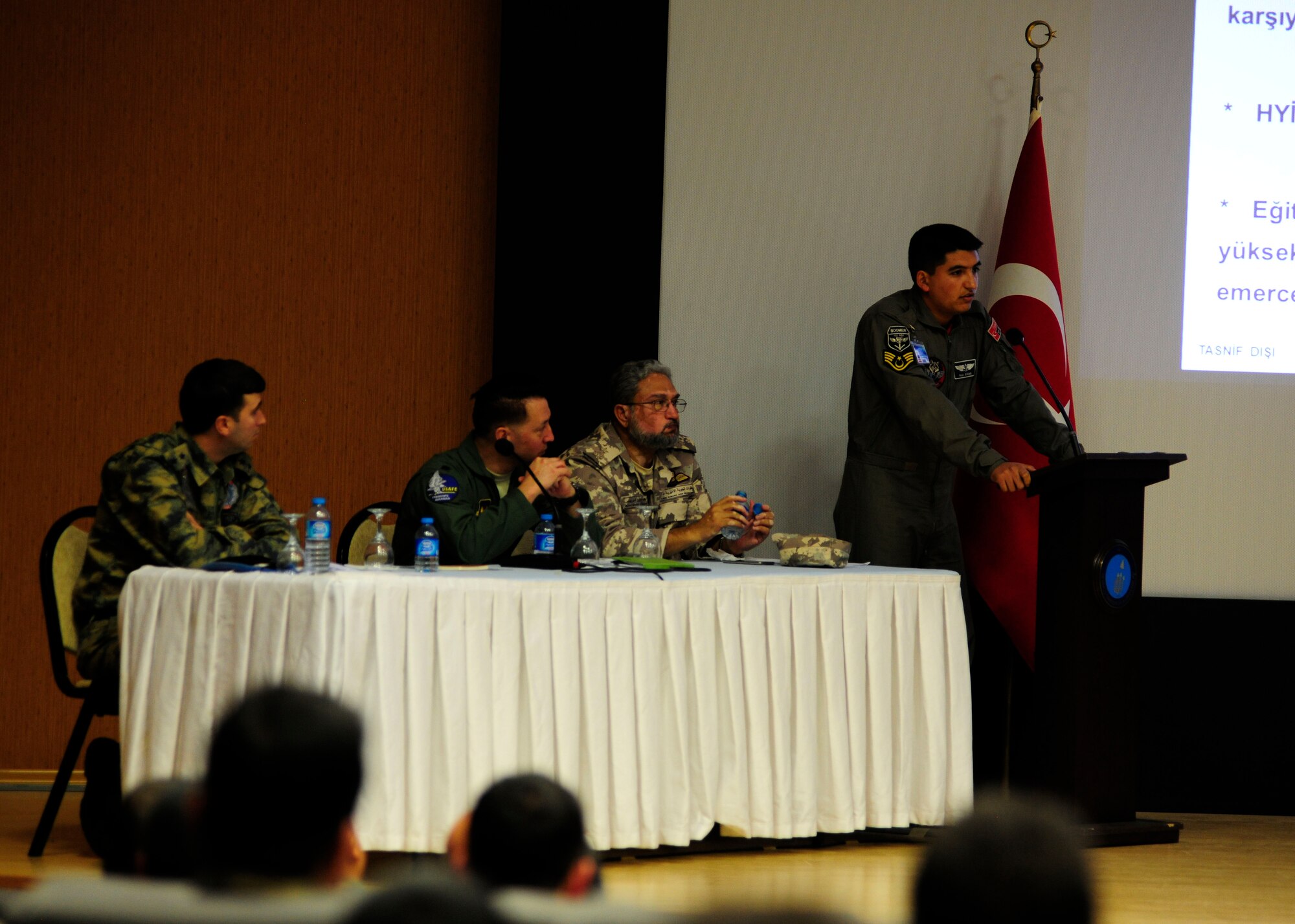 Subject Matter Experts from U.S. Air Force, the Turkish air force and the Qatar Emiri air force take turns presenting important issues during a safety meeting Dec. 8, 2015, at Incirlik Air Base, Turkey. The annual event brought together personnel from four different air forces to discuss flight and ground safety trends, issues and procedures. (U.S. Air Force photo by Senior Airman Krystal Ardrey/Released)