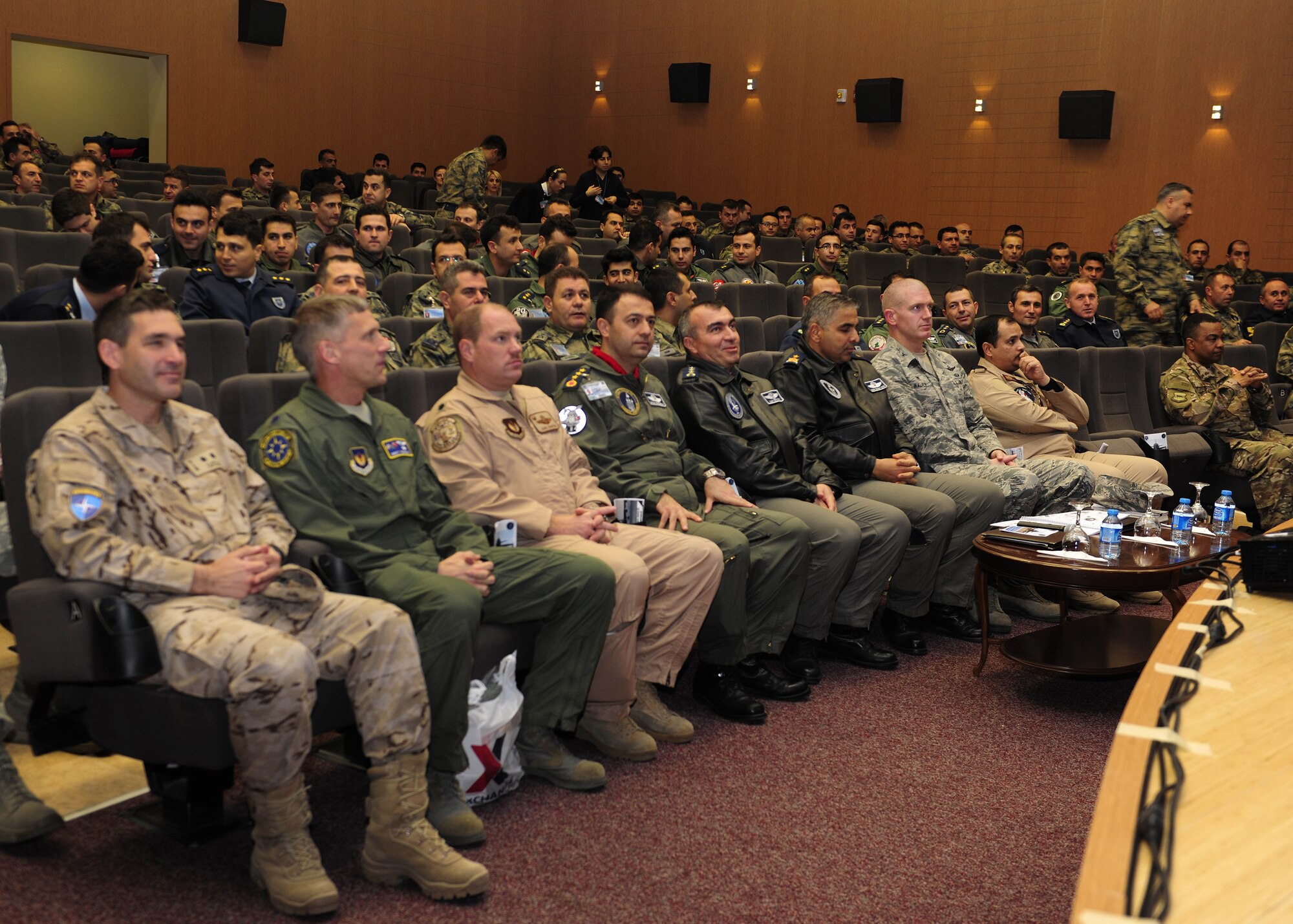 Leaders from the 39th Air Base Wing, 10th Tanker Base Command, Spanish Patriot Unit and Qatar Emiri air force, listen to a presentation during an annual safety meeting Dec. 8, 2015, at Incirlik Air Base, Turkey. The meeting featured subject matter experts from the U.S. Air Force, the Turkish air force and the Qatar Emiri air force who discussed issues of importance to the flight and ground safety community. (U.S. Air Force photo by Senior Airman Krystal Ardrey/Released)
