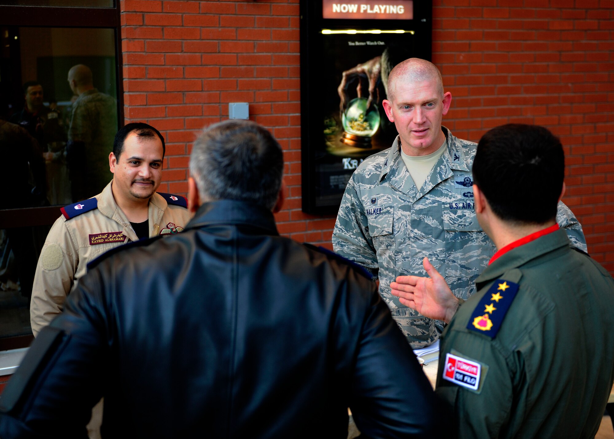 Leaders from the U.S. Air Force, the Turkish air force and the Qatar Emiri air force speak while on break during a safety meeting Dec. 8, 2015, at Incirlik Air Base, Turkey. The meeting featured speakers from all three air forces who gave presentations on issues affecting flight and ground safety community. (U.S. Air Force photo by Senior Airman Krystal Ardrey/Released)