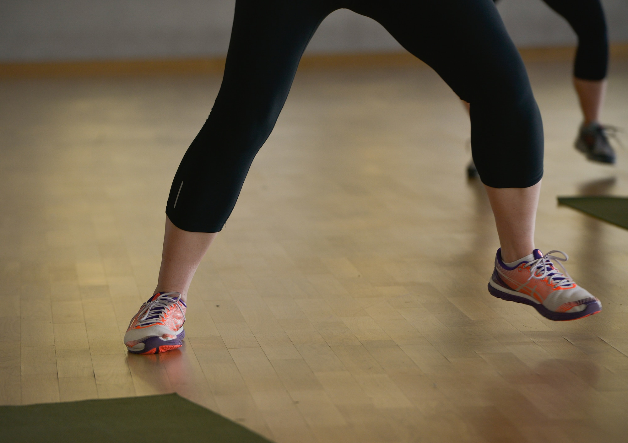 A Tabata class participant sidesteps during a class at the Ramstein Southside Fitness Center Dec. 7, 2015, at Ramstein Air Base, Germany. The fitness center offers several different classes people can use to help them obtain their fitness goals. (U.S. Air Force photo/Airman 1st Class Lane T. Plummer)