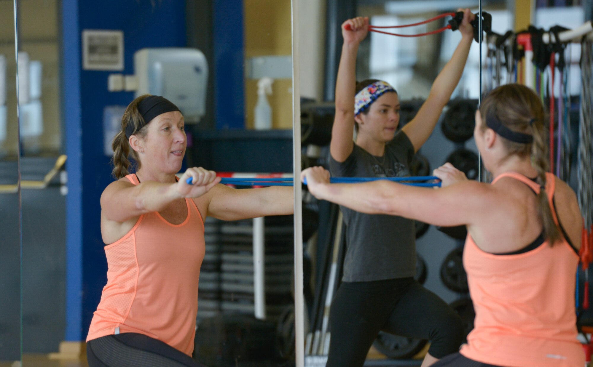A gym class instructor lunges while stretching a rope tightly during a core performance session at the Ramstein Southside Fitness Center Dec. 8, 2015, at Ramstein Air Base, Germany. The fitness center provides a variety of classes that exercise different muscle groups at different levels of intensity. (U.S. Air Force photo/Airman 1st Class Lane T. Plummer)