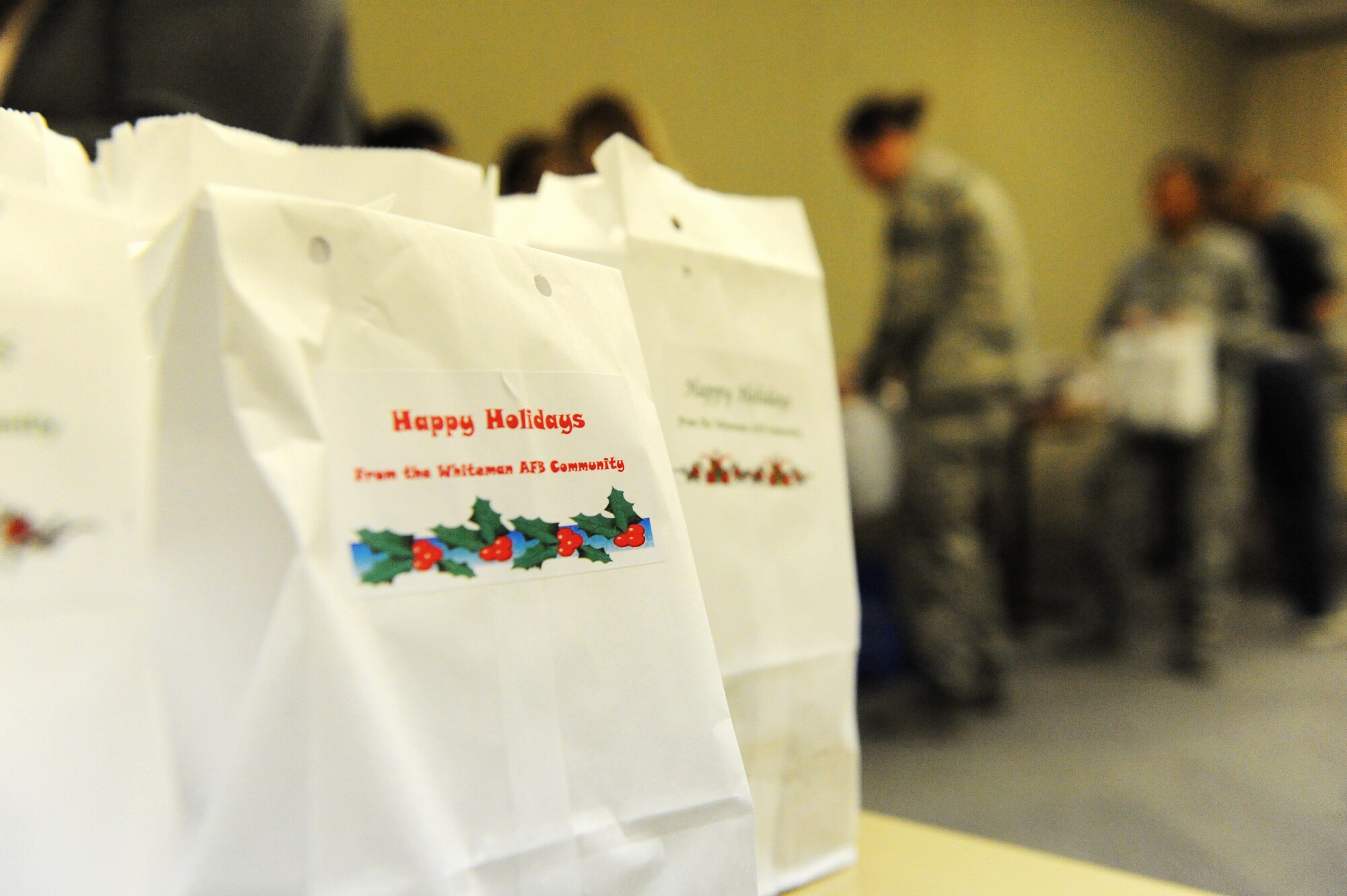 Bags filled with cookies sit on a table during a holiday cookie drive at Whiteman Air Force Base, Mo., Dec. 10, 2015.  Volunteers collected, divided, bagged and distributed more than 600 cookies to unaccompanied and single Airmen living in the dorms. (U.S. Air Force photo by Tech. Sgt. Miguel Lara III)