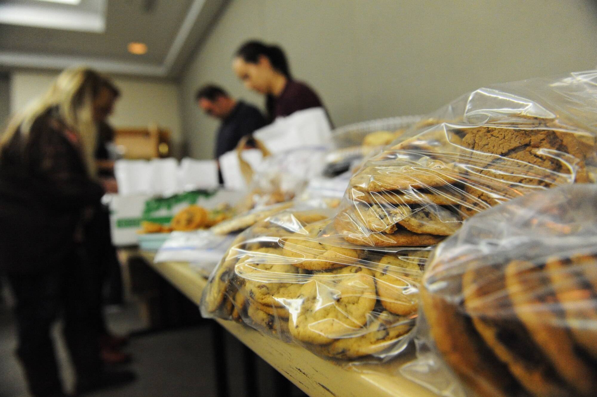 Members of Team Whiteman donated cookies during a holiday cookie drive held at Whiteman Air Force Base, Mo., Dec. 10, 2015. The cookies were bagged, packaged and distributed to unaccompanied and single Airmen living in the dorms. (U.S. Air Force photo by Tech. Sgt. Miguel Lara III)