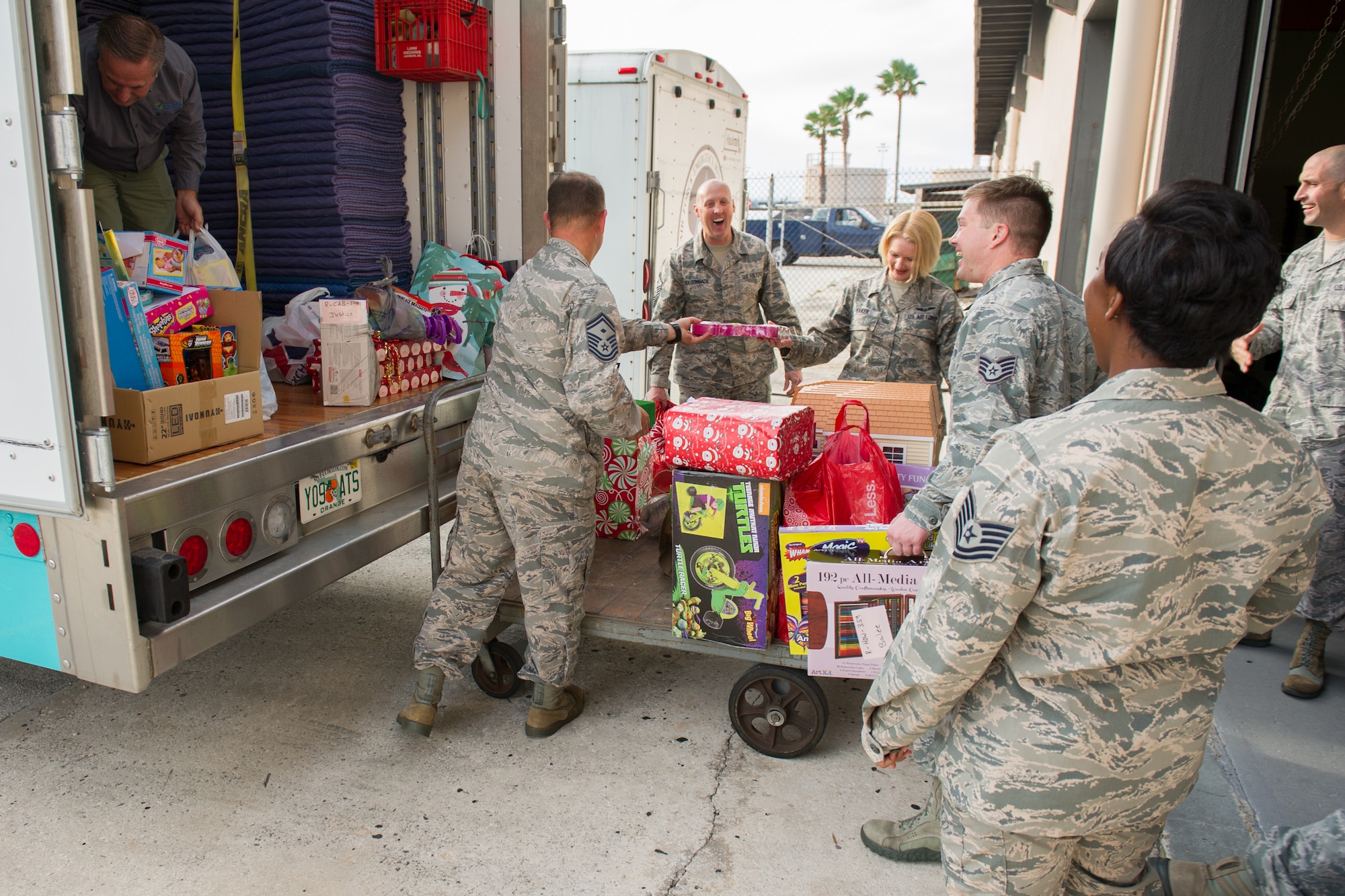 The Patrick AFB and Cape Canaveral AFS First Sergeant's Council collected more than 600 toys, and donated to the Brevard Family Partnership for an annual toy drive in support of children in foster care, Dec. 8, 2015, at Patrick Air Force Base, Fla. Each year, the Brevard Family Partnership relies on numerous organizations and companies to support the event, which made for a total estimate value of $8,000. (U.S. Air Force photo/Benjamin Thacker) (Released) 