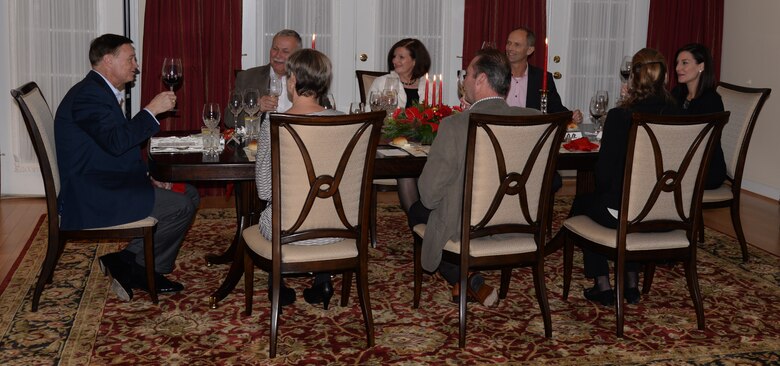 Air Force District of Washington Commander Maj. Gen. Darryl Burke offers a toast to begin a dinner with Air Attachés from Germany, Denmark, and Belgium Dec. 10, 2015. Burke hosted the Air Attachés at his residence to help build and sustain relationships between the U.S. and their respective countries. Air Force District of Washington provides manpower, personnel and services support for designated Air Force activities within the National Capital Region and for more than 26,000 Airmen performing duties worldwide in 108 countries. (U.S. Air Force Photo/1 Lt. Esther Willett)