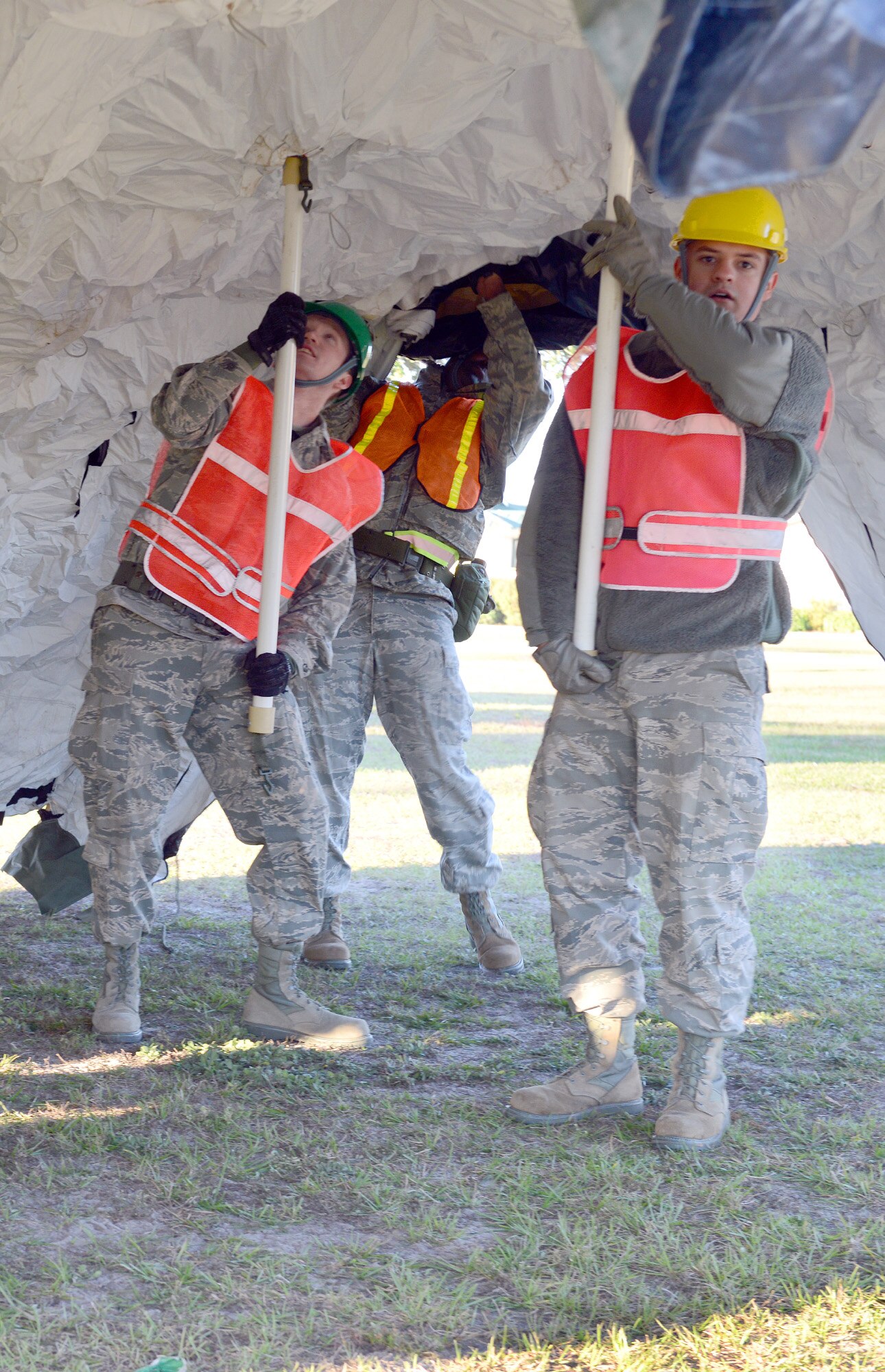 51st Combat Communications Squadron airmen raise a tent that will serve as the Communications Focal Point during an exercise Dec. 6.  (U.S. Air Force photo by Tommie Horton)