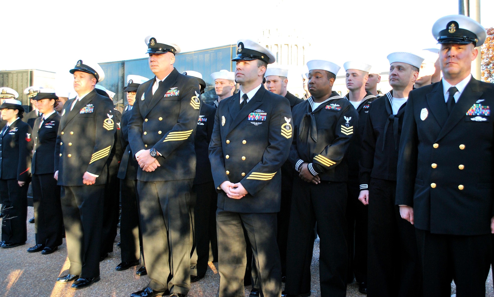 Strategic Communications Wing ONE Sailors gathered Monday at State Capitol Park to honor Sailors lost in the 1941 attack on the Pearl Harbor naval base. They included, from left, Master-at-Arms Senior Chief Ruben Villanueva, Command Master Chief Jeffrey Bottoms, Master-at-Arms Chief Shawn Buckman and Master-at-Arms Chief Kenneth Brenek. (Courtesy photo/Released)