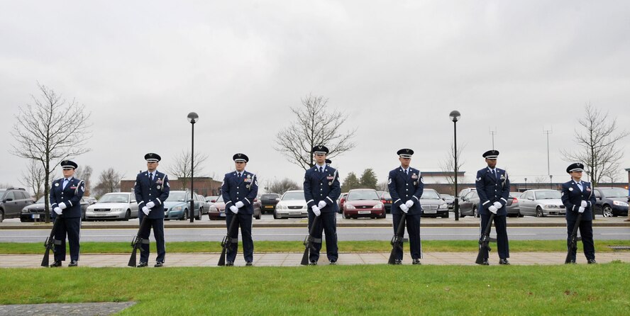 The 423rd Air Base Group Honor Guard stand at parade rest during the 74th Pearl Harbor Commemoration Ceremony at RAF Molesworth, United kingdom, Dec. 7, 2015. The ceremony included a three-volley salute by the honor guard and a formation salute as 48th Fighter Wing F-15 Eagle pilots performed a flyby. (U.S. Air Force photo by Staff Sgt. Ashley Tyler/Released)