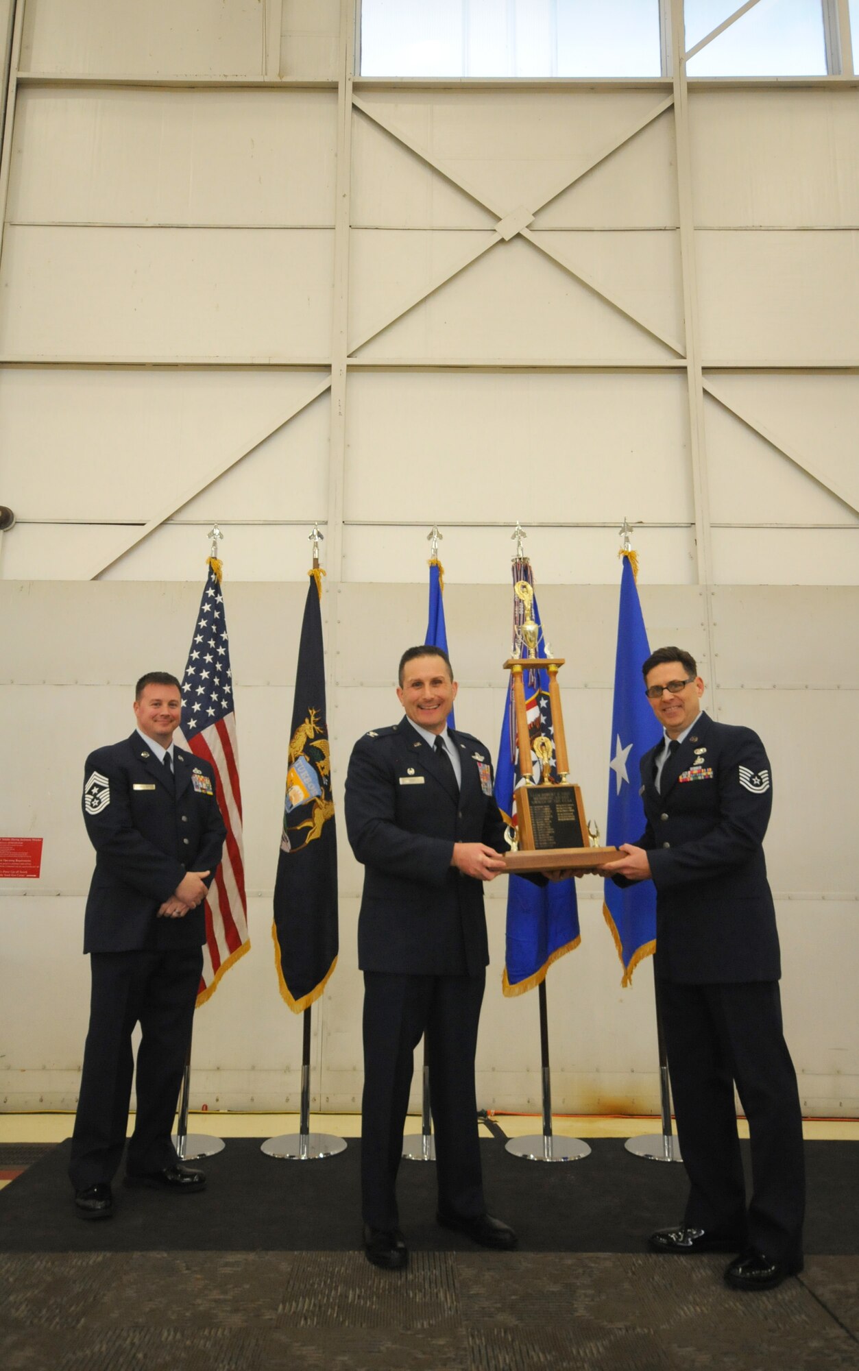 Col. Bryan Teff announces and congratulates the 2015 Airman of the Year recipients, Saturday, December 5, 2015, Battle Creek Air National Guard Base, Mich. Members awarded include, Airman of the Year, Senior Airman Erik Elliot, 110th Operations Support Squadron, Non-Commissioned Officer of Year, Tech. Sgt. Richard Parker II, 217th Air Component Operations Squadron, Senior Non-Commissioned Officer of the Year, Master Sgt. Carl Westphal II, 217th Air Operations Squadron, Company Grade Officer of the Year, 1st Lt. Justin Andrews, 217th Air Component Operations Squadron, 1st Sgt. of the Year, Master Sgt. Darrell Kingsbury, 217th Air Operations Group, Honor Guard Member of the Year, Staff Sgt. Amanda Bean, Battle Creek Air National Guard Enlisted Memorial Scholarship recipient, Jacob Zahm, annual 110th Attack Wing Outstanding Unit Safety Representative, Master Sgt. Felica Harris, and Outstanding Individual Safety Contribution, Master Sgt. Luke Wimby, and 110th Attack Wing Guardsman of the year, Staff Sgt. Amanda Bean. (Air National Guard Photo by Master Sgt. Sonia Pawloski/released)