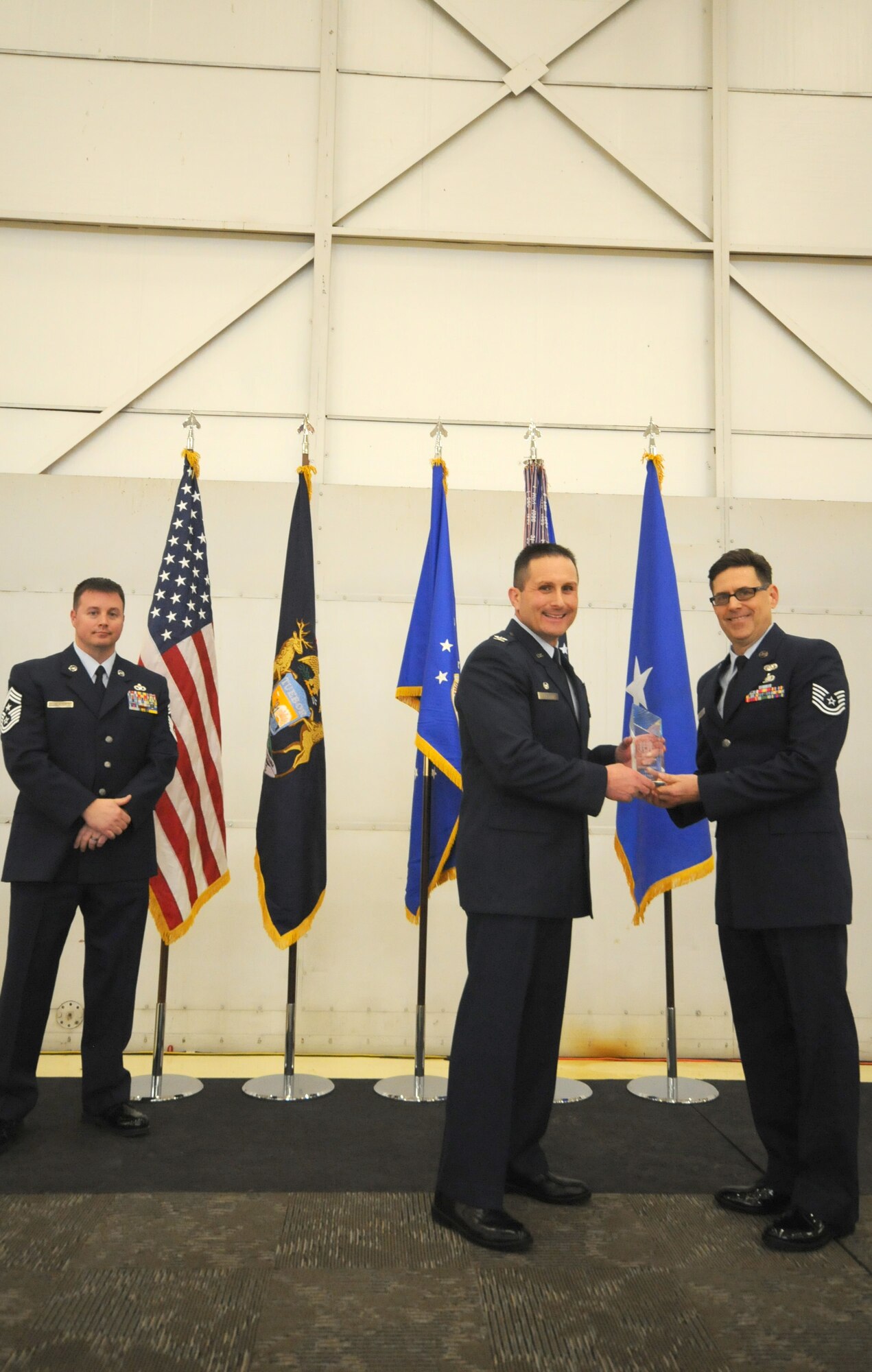 Col. Bryan Teff announces and congratulates the 2015 Airman of the Year recipients, Saturday, December 5, 2015, Battle Creek Air National Guard Base, Mich. Members awarded include, Airman of the Year, Senior Airman Erik Elliot, 110th Operations Support Squadron, Non-Commissioned Officer of Year, Tech. Sgt. Richard Parker II, 217th Air Component Operations Squadron, Senior Non-Commissioned Officer of the Year, Master Sgt. Carl Westphal II, 217th Air Operations Squadron, Company Grade Officer of the Year, 1st Lt. Justin Andrews, 217th Air Component Operations Squadron, 1st Sgt. of the Year, Master Sgt. Darrell Kingsbury, 217th Air Operations Group, Honor Guard Member of the Year, Staff Sgt. Amanda Bean, Battle Creek Air National Guard Enlisted Memorial Scholarship recipient, Jacob Zahm, annual 110th Attack Wing Outstanding Unit Safety Representative, Master Sgt. Felica Harris, and Outstanding Individual Safety Contribution, Master Sgt. Luke Wimby, and 110th Attack Wing Guardsman of the year, Staff Sgt. Amanda Bean. (Air National Guard Photo by Master Sgt. Sonia Pawloski/released)