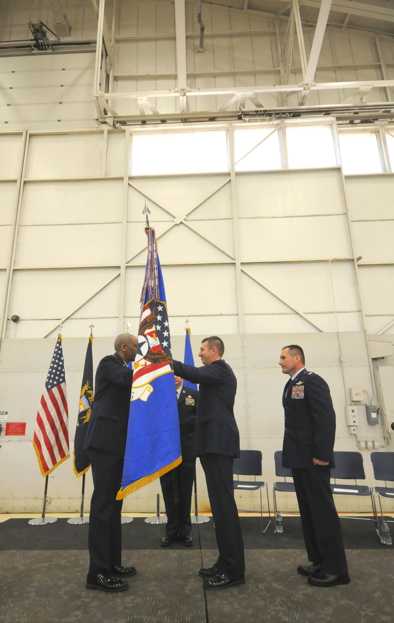 Col. Bryan Teff assumes command of the 110th Attack Wing, Battle Creek Air National Guard Base, Mich., Saturday, December 5, 2015 in the hangar of the Wing. Teff will be taking over the role of commander from Col. Ronald Wilson who has been the wing commander for three years. (Air National Guard Photo by Master Sgt. Sonia Pawloski/released)