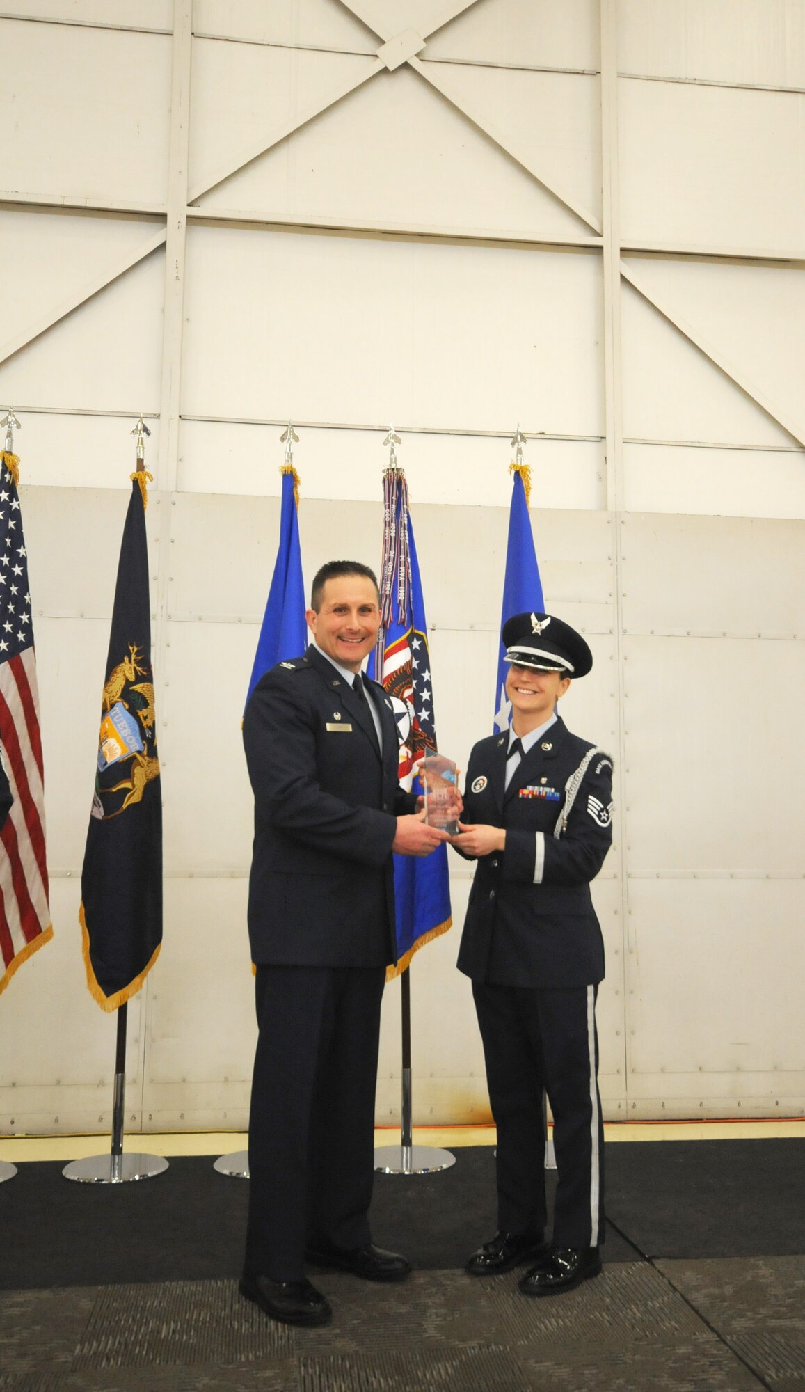 Col. Bryan Teff announces and congratulates the 2015 Airman of the Year recipients, Saturday, December 5, 2015, Battle Creek Air National Guard Base, Mich. Members awarded include, Airman of the Year, Senior Airman Erik Elliot, 110th Operations Support Squadron, Non-Commissioned Officer of Year, Tech. Sgt. Richard Parker II, 217th Air Component Operations Squadron, Senior Non-Commissioned Officer of the Year, Master Sgt. Carl Westphal II, 217th Air Operations Squadron, Company Grade Officer of the Year, 1st Lt. Justin Andrews, 217th Air Component Operations Squadron, 1st Sgt. of the Year, Master Sgt. Darrell Kingsbury, 217th Air Operations Group, Honor Guard Member of the Year, Staff Sgt. Amanda Bean, Battle Creek Air National Guard Enlisted Memorial Scholarship recipient, Jacob Zahm, annual 110th Attack Wing Outstanding Unit Safety Representative, Master Sgt. Felica Harris, and Outstanding Individual Safety Contribution, Master Sgt. Luke Wimby, and 110th Attack Wing Guardsman of the year, Staff Sgt. Amanda Bean. (Air National Guard Photo by Master Sgt. Sonia Pawloski/released)