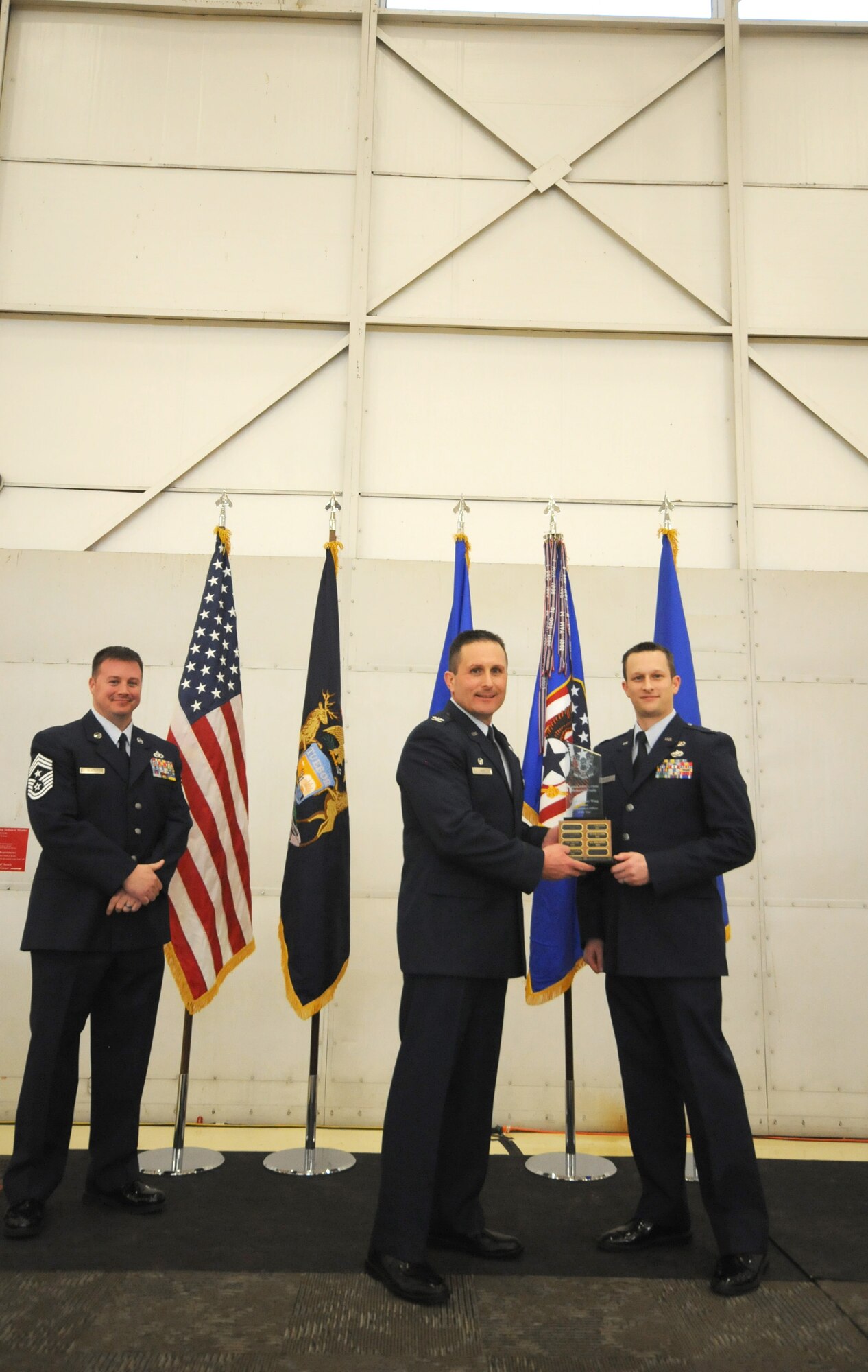 Col. Bryan Teff announces and congratulates the 2015 Airman of the Year recipients, Saturday, December 5, 2015, Battle Creek Air National Guard Base, Mich. Members awarded include, Airman of the Year, Senior Airman Erik Elliot, 110th Operations Support Squadron, Non-Commissioned Officer of Year, Tech. Sgt. Richard Parker II, 217th Air Component Operations Squadron, Senior Non-Commissioned Officer of the Year, Master Sgt. Carl Westphal II, 217th Air Operations Squadron, Company Grade Officer of the Year, 1st Lt. Justin Andrews, 217th Air Component Operations Squadron, 1st Sgt. of the Year, Master Sgt. Darrell Kingsbury, 217th Air Operations Group, Honor Guard Member of the Year, Staff Sgt. Amanda Bean, Battle Creek Air National Guard Enlisted Memorial Scholarship recipient, Jacob Zahm, annual 110th Attack Wing Outstanding Unit Safety Representative, Master Sgt. Felica Harris, and Outstanding Individual Safety Contribution, Master Sgt. Luke Wimby, and 110th Attack Wing Guardsman of the year, Staff Sgt. Amanda Bean. (Air National Guard Photo by Master Sgt. Sonia Pawloski/released)