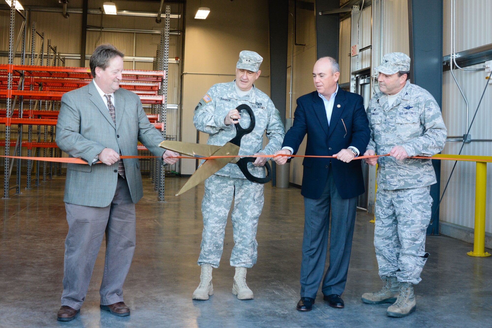 From left: Bill Falkner, mayor of St. Joseph, U.S. Army Maj. Gen. Stephen L. Danner, the adjutant general of the Missouri National Guard, Harry Roberts, presiding commissioner of Buchanan County, and U.S. Air Force Col. Ralph Schwader, commander of the 139th Airlift Wing, attend a ribbon cutting ceremony at Rosecrans Air National Guard Base, St. Joseph, Mo., Dec. 10, 2015. The ceremony was for the opening of the 139th Airlift Wing’s new security forces building. The building is 6,000 square feet and will be used by the 139th Security Forces Squadron which is responsible for protecting the wing’s personnel and property. (U.S. Air National Guard photo by Tech. Sgt. Michael Crane)