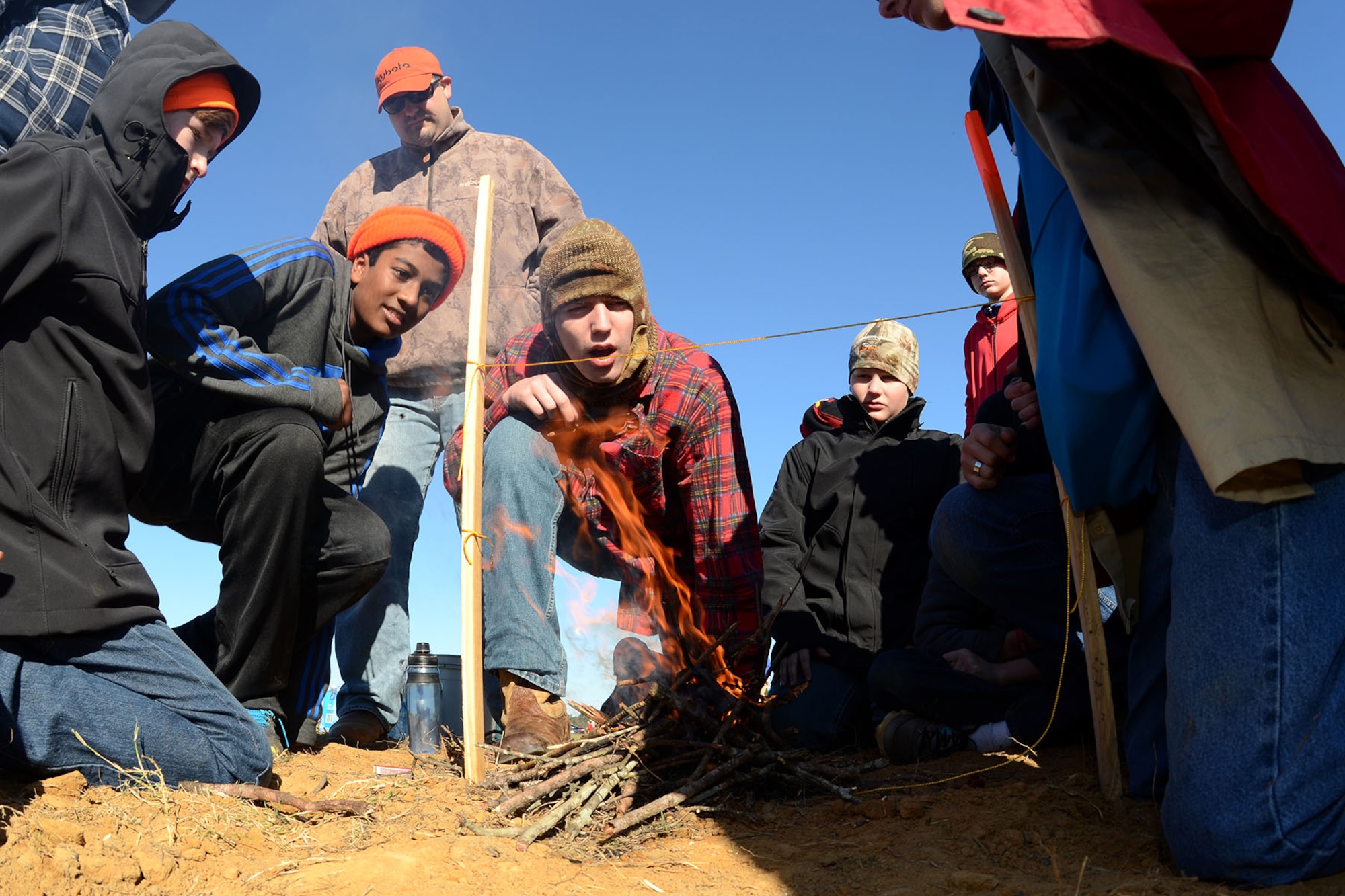 Boy Scouts with Troop 429 participate in a string burning competition during the Swamp Fox Camporee at McEntire Joint National Guard Base, S.C., Dec. 5, 2015. The event was hosted by the South Carolina National Guard to allow Cub Scouts and Boy Scouts the opportunity to interact with Guardsmen and compete to earn various merit badges. (U.S. Air National Guard photo by Airman Megan Floyd/RELEASED)