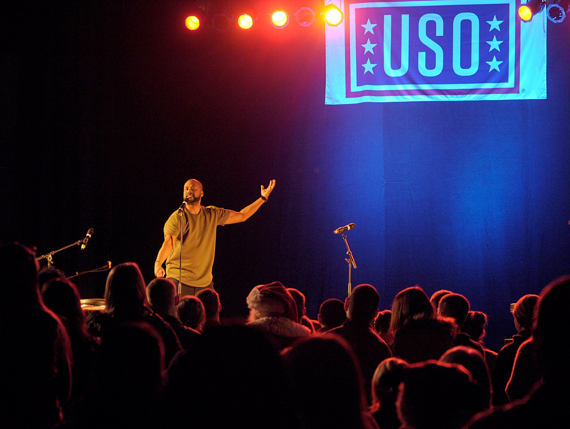 Comedian Sydney Castillo performs during the 2015 USO Holiday Troop Tour Dec. 9, 2015, at Ramstein Air Base, Germany. Castillo and other celebrities joined U.S. Marine Corps Gen. Joseph F. Dunford, chairman of the Joint Chiefs of Staff, as a way to show thanks to service members and their families. (U.S. Air Force photo/Staff Sgt. Timothy Moore)