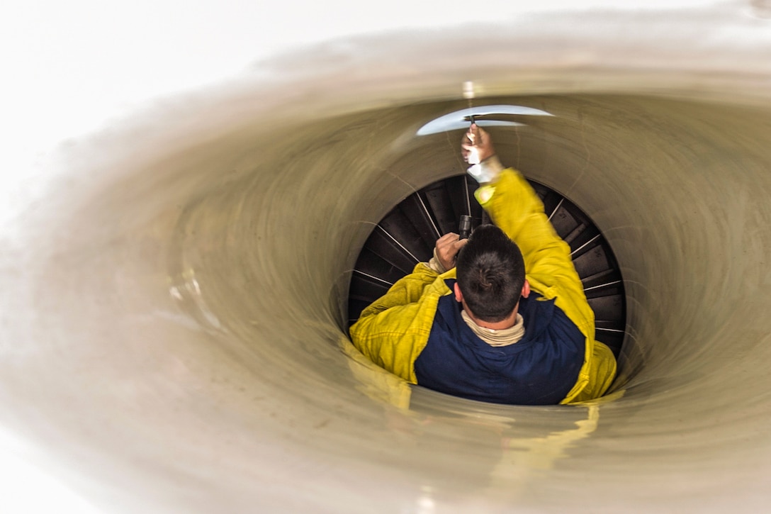 U.S. Air Force Staff Sgt. Steven Benton performs an intake inspection on an F-16 Fighting Falcon on Bagram Airfield, Afghanistan, Nov. 30, 2015. Benton is a crew chief assigned to the 455th Expeditionary Aircraft Maintenance Squadron, which provides combat-ready aircraft to support coalition forces throughout Afghanistan. U.S. Air Force Photo by Tech. Sgt. Robert Cloys