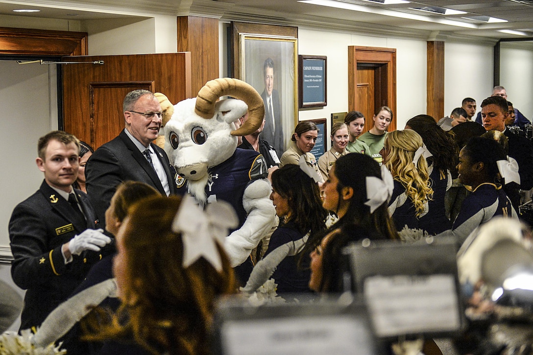 Deputy Secretary of Defense Bob Work hosts a pep rally with Navy midshipmen at the Pentagon, Dec. 10, 2015, before the upcoming Army-Navy game. During the Dec. 12 game, cadets from the U.S. Military Academy at West Point, N.Y., play midshipmen from the U.S. Naval Academy in Philadelphia. DoD photo by U.S. Army Sgt. 1st Class Clydell Kinchen
