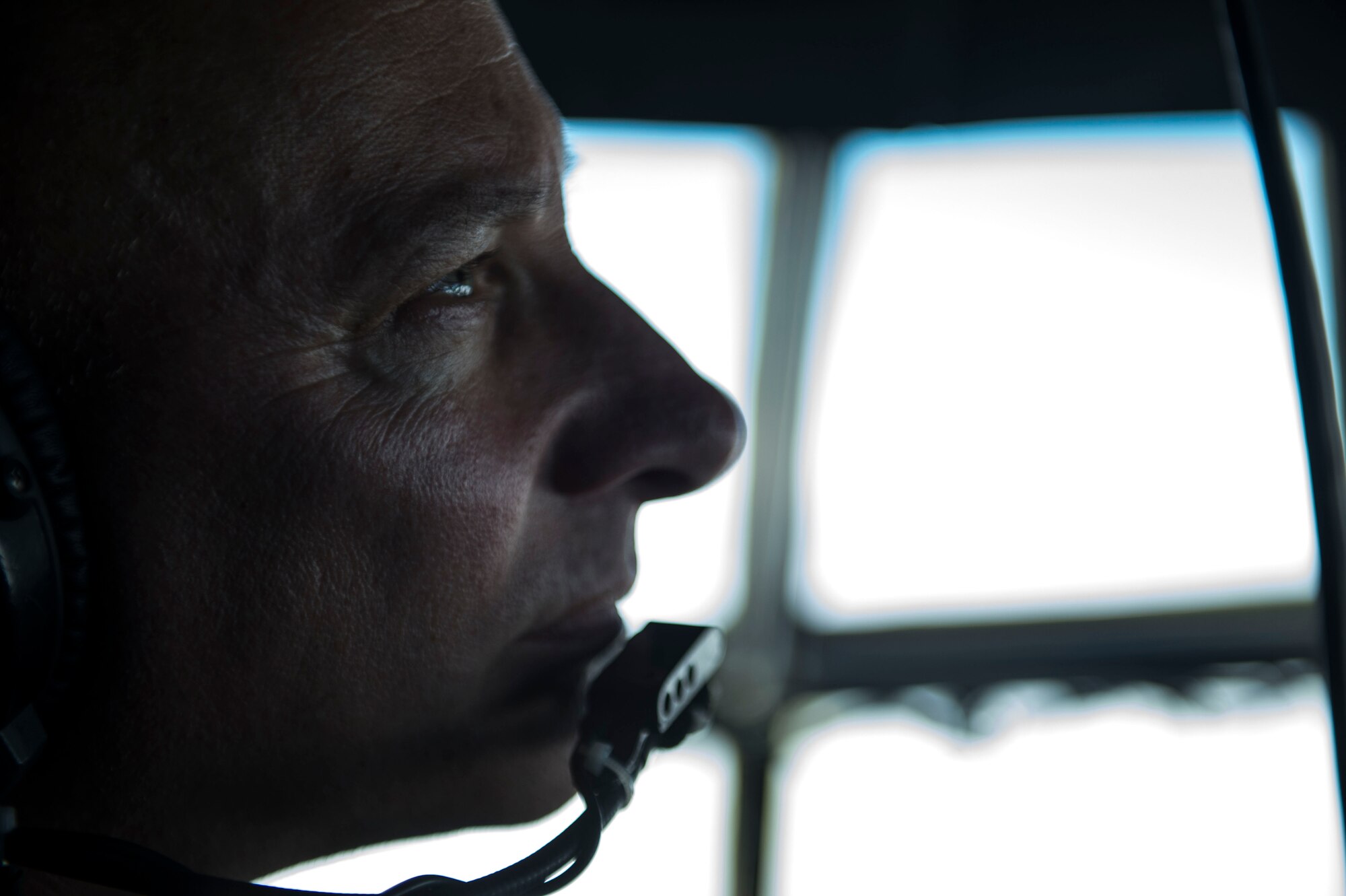 U.S Air Force Chief Master Sgt. Mike Delgiacco sits inside a cockpit of a C-130H Hercules near Kabul, Afghanistan, Dec. 6, 2015. Delgiacco’s mission is to train, advise, and assist our Afghan partners to develop a professional, capable, and sustainable Air Force.  (U.S. Air Force photo by Staff Sgt. Corey Hook/Released)