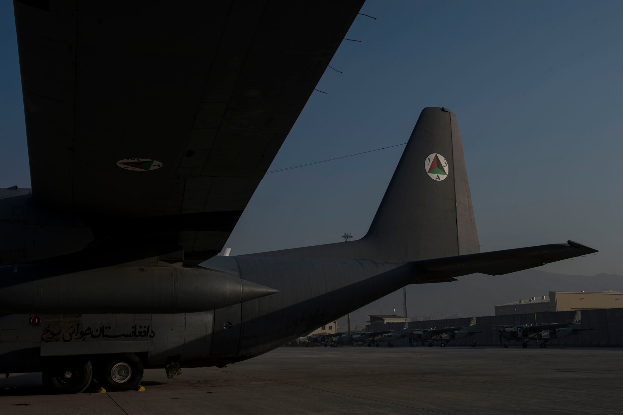 An Afghan Air Force C-130H Hercules sits on the flightline at Hamid Karzai International Airport, Kabul, Afghanistan, Dec. 7, 2015. The C-130 has a rich history of providing military airlift around the world.  Its short takeoff and landing capability makes it an optimum fit for Afghanistan’s rugged terrain. (U.S. Air Force photo by Staff Sgt. Corey Hook/Released)