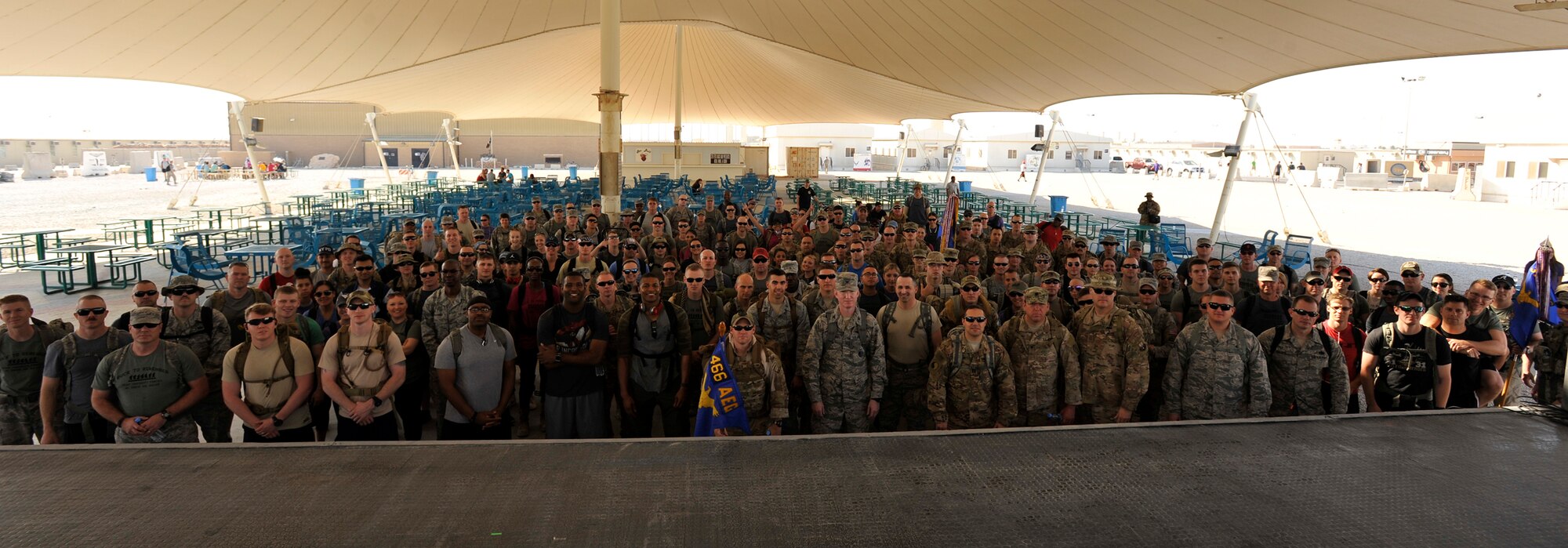 Members of Al Udeid Air Base, Qatar pose for a group photo before beginning the Fallen Defenders Ruck to Remember here, Dec. 12, 2015. The 12 kilometer ruck march honors security forces Defenders who have made the ultimate sacrifice in support of operations in Iraq and Afghanistan. (U.S. Air Force photo by Master Sgt. Joshua Strang)