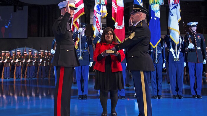 U.S. Marine Gen. Joseph F. Dunford Jr., chairman of the Joint Chiefs of Staff, swears in U.S. Army Command Sgt. Maj. John W. Troxell as the third senior enlisted advisor to the chairman of the Joint Chiefs of Staff during a change of responsibility ceremony at Joint Base Myer-Henderson Hall, Va., Dec. 11, 2015. It included a ceremony honoring outgoing SEAC Marine Corps Sgt. Maj. Bryan B. Battaglia, who's scheduled to retire in April 2016 after nearly 36 years of service.
