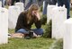 Emily Johnson sheds tears in front of the headstone for her older brother, Army 1st Lt. David Andrew Johnson, who was killed by an improvised explosive device in 2012. Johnson and other family members of fallen troops as well as thousands of volunteers were at the Arlington National Cemetery, Va., on Dec. 12, 2015, for Wreaths Across America Day, an event to honor veterans during the holidays. (U.S. Air Force photo/Sean Kimmons)
