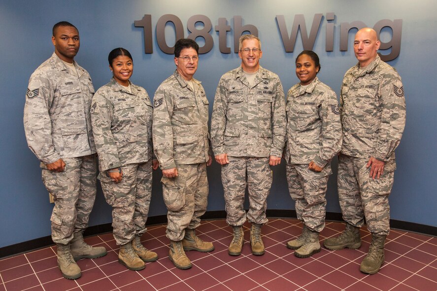 Col. Vito A. DiMicco Jr., third from right, Commander, 108th Mission Support Group, administered the Oath of Enlistment to 108th Wing, New Jersey Air National Guard members, left to right, Staff Sgt. James B. Harris, Senior Airman Chanis L. Brown, Staff Sgt. Kerry L. Cornelius Jr., and Tech. Sgts. Yvette N. Hackett and Richard P. Thomas at a re-enlistment ceremony at the Wing headquarters at Joint Base McGuire-Dix-Lakehurst, N.J. Dec. 12, 2015. (U.S. Air National Guard photo by Master Sgt. Mark C. Olsen/Released)