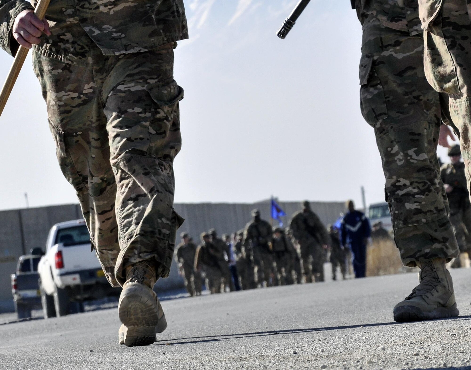 Bagram service members march during the “Ruck to Remember,” a 12-kilometer ruck march at Bagram Airfield, Afghanistan Dec. 12, 2015. The event was designed to honor the sacrifices these Defenders made and to celebrate their lives. (U.S. Air Force photo by Tech. Sgt. Nicholas Rau/Released)