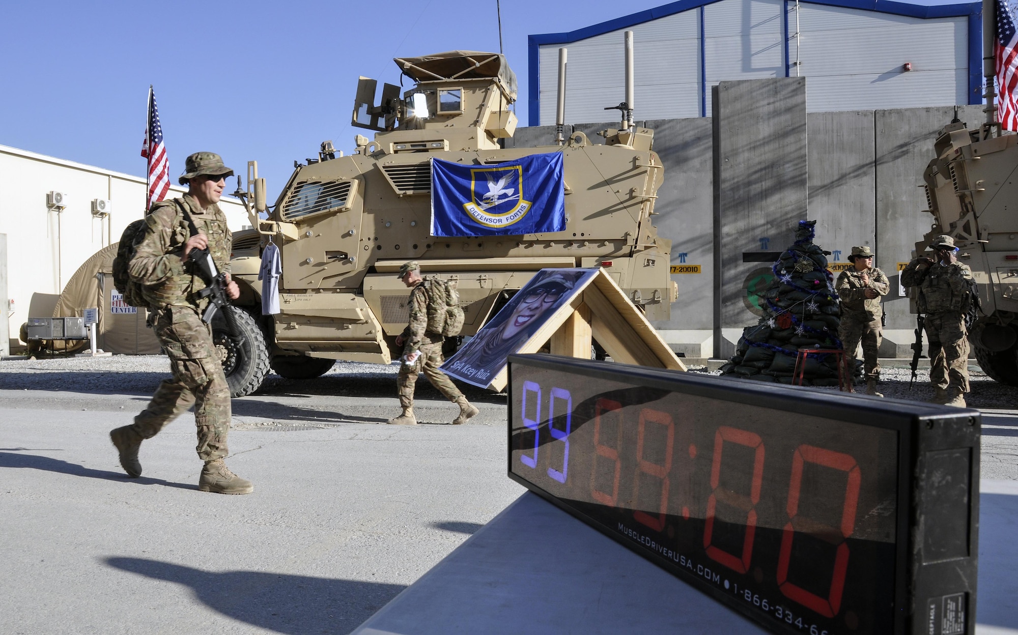 Staff Sgt. Ryan Bender, 455th Expeditionary Maintenance Squadron, crosses the finish line at the end of the “Ruck to Remember,” a 12-kilometer ruck march at Bagram Airfield, Afghanistan Dec. 12, 2015. The event was designed to honor the sacrifices these Defenders made and to celebrate their lives. (U.S. Air Force photo by Tech. Sgt. Nicholas Rau/Released)