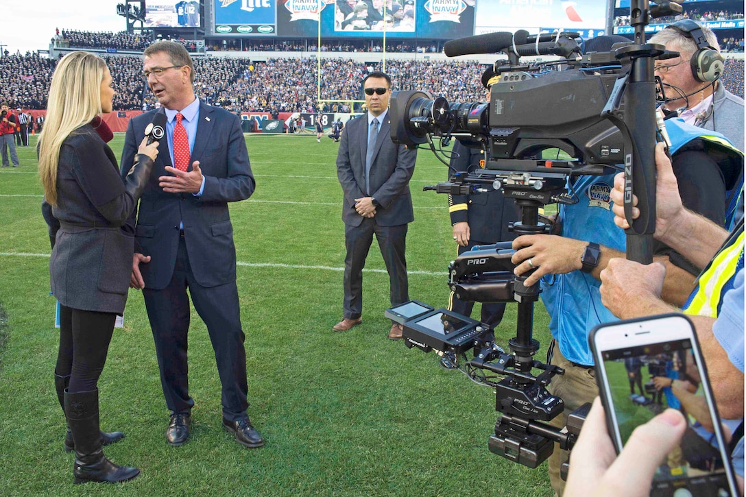 A reporter interviews Defense Secretary Ash Carter before the start of the 2015 Army-Navy football game in Philadelphia, Dec. 12, 2015. DoD photo by Navy Petty Officer 1st Class Tim D. Godbee