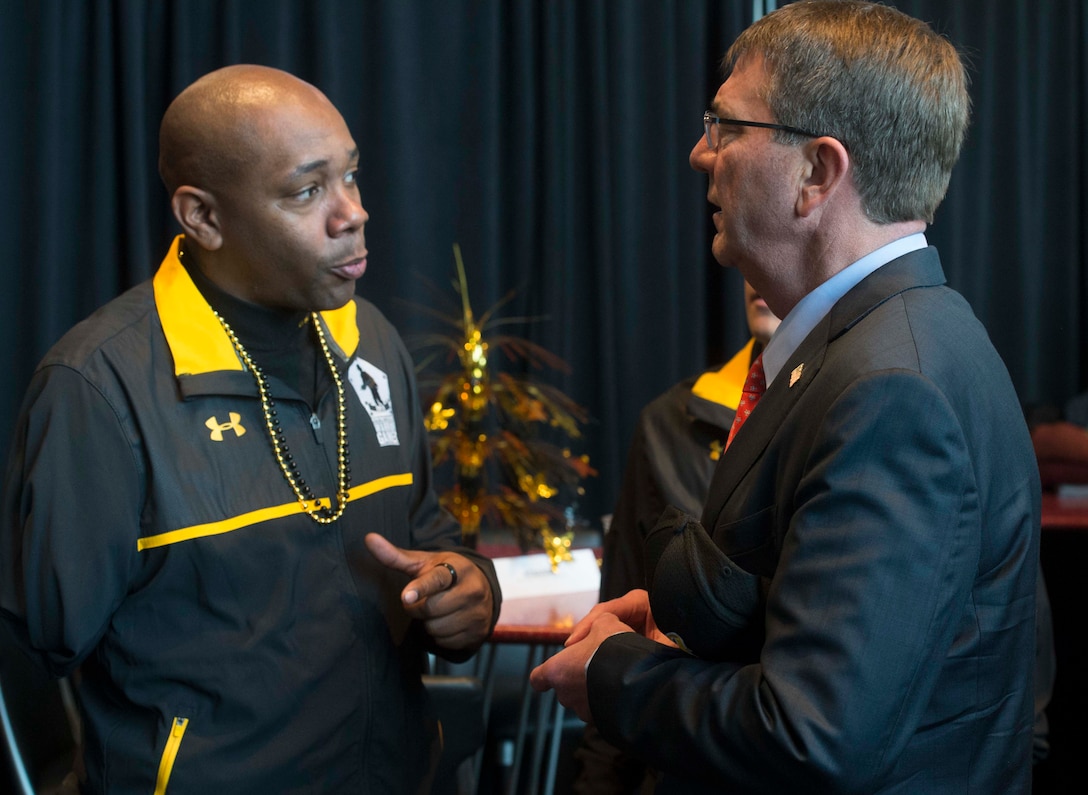Defense Ash Carter talks with an Army wounded warrior at the 2015 Army-Navy football game in Philadelphia, Dec. 12, 2015. DoD photo by Navy Petty Officer 1st Class Tim D. Godbee