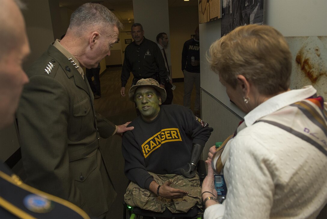 Marine Corps Gen. Joseph F. Dunford Jr., chairman of the Joint Chiefs of Staff, talks with members of the Army Wounded Warrior Program at the 116th Army-Navy football game in Philadelphia, Dec. 12, 2015. DoD photo by Navy Petty Officer 2nd Class Dominique A. Pineiro
