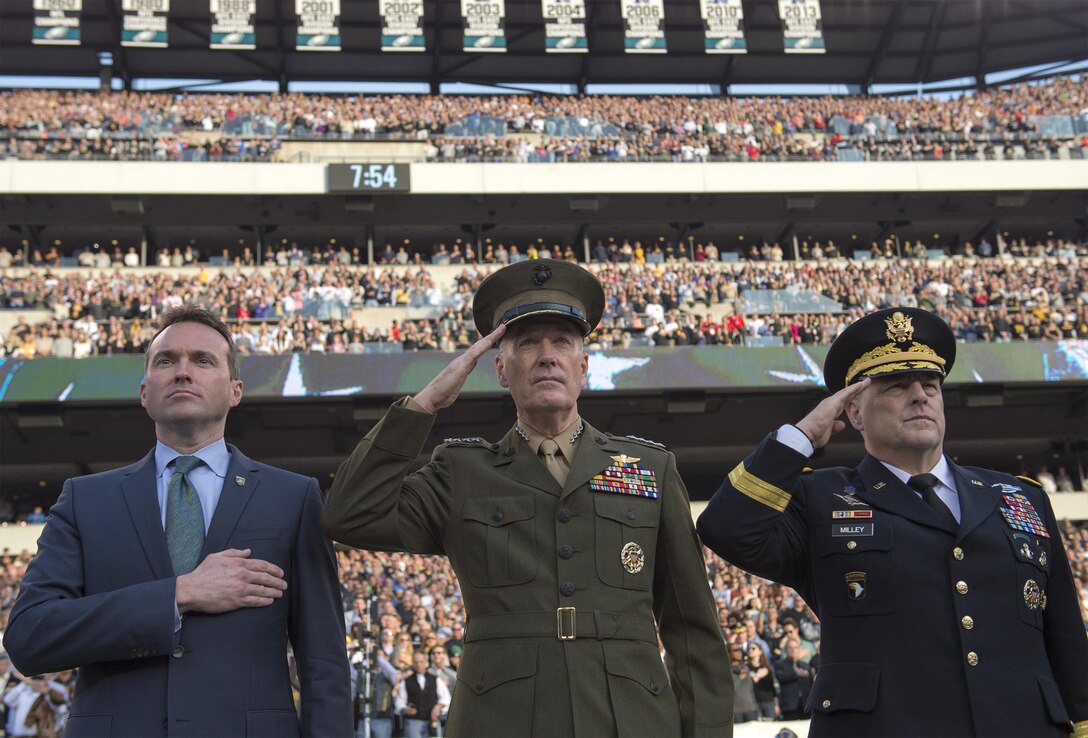 Marine Corps Gen. Joseph F. Dunford Jr., center, chairman of the Joint Chiefs of Staff, Acting Army Secretary Eric Fanning, left, and Chief of Staff of the Army Gen. Mark A. Milley salute during the national anthem at the Army-Navy football game in Philadelphia, Dec. 12, 2015. DoD photo by Navy Petty Officer 2nd Class Dominique A. Pineiro