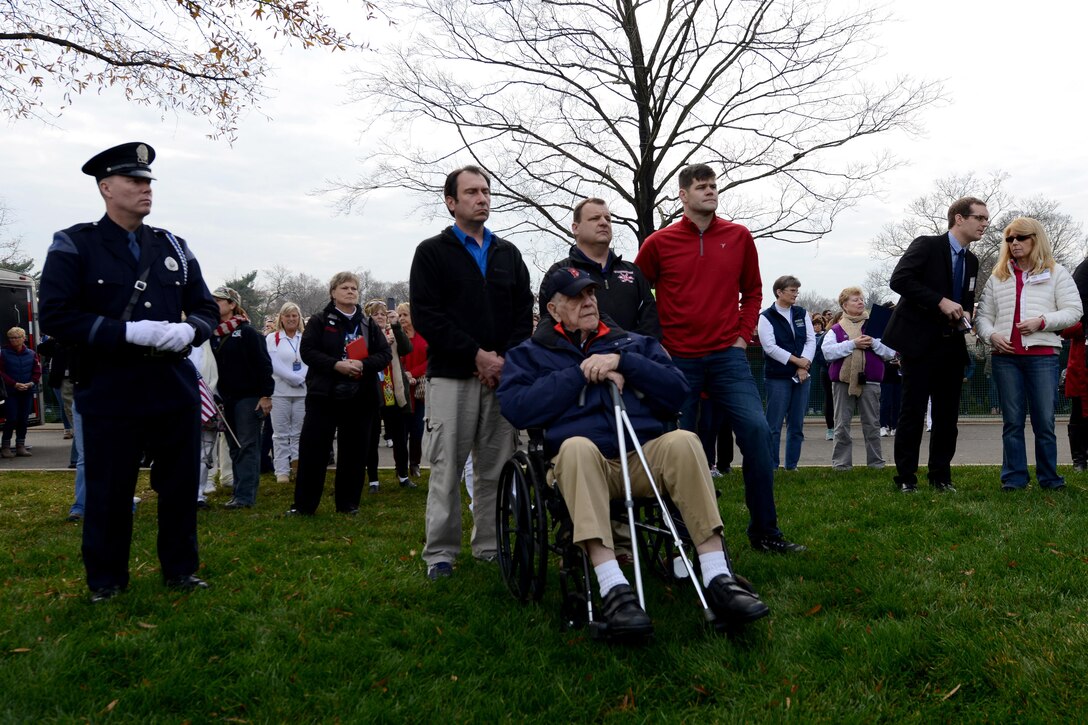 Arthur Best, foreground, World War II veteran, family members and Kevin Haley, a police officer from Portland, Maine, listen to opening remarks during Wreaths Across America in Arlington National Cemetery in Arlington, Va., Dec. 12, 2015. DoD photo by Sebastian Sciotti Jr. 