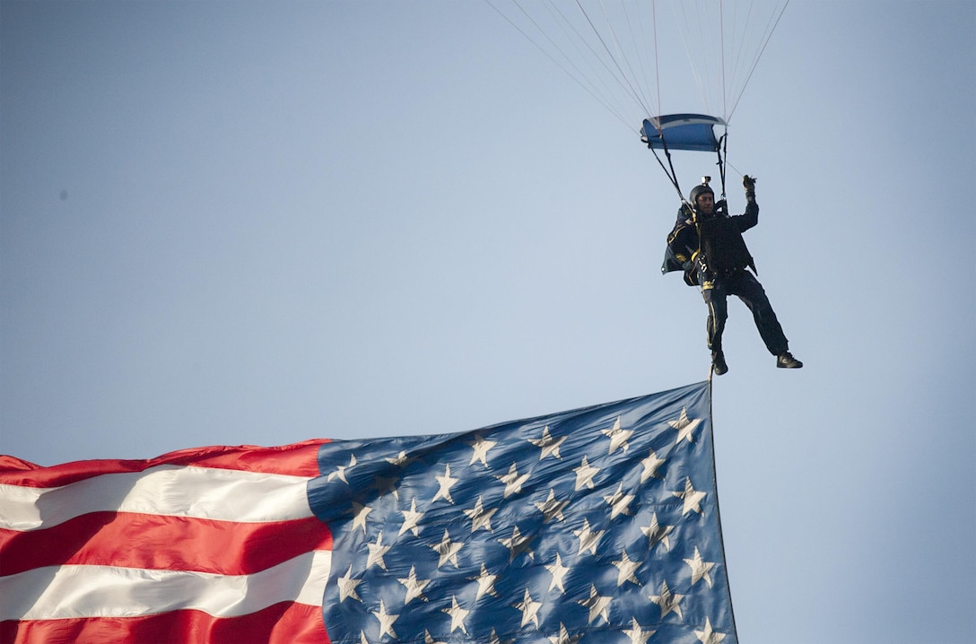 A member of the U.S. Navy parachute team, the Leap Frogs, jumps into the stadium prior to the 116th Army-Navy football game in Philadelphia, Dec. 12, 2015. DoD photo by Navy Petty Officer 2nd Class Dominique A. Pineiro