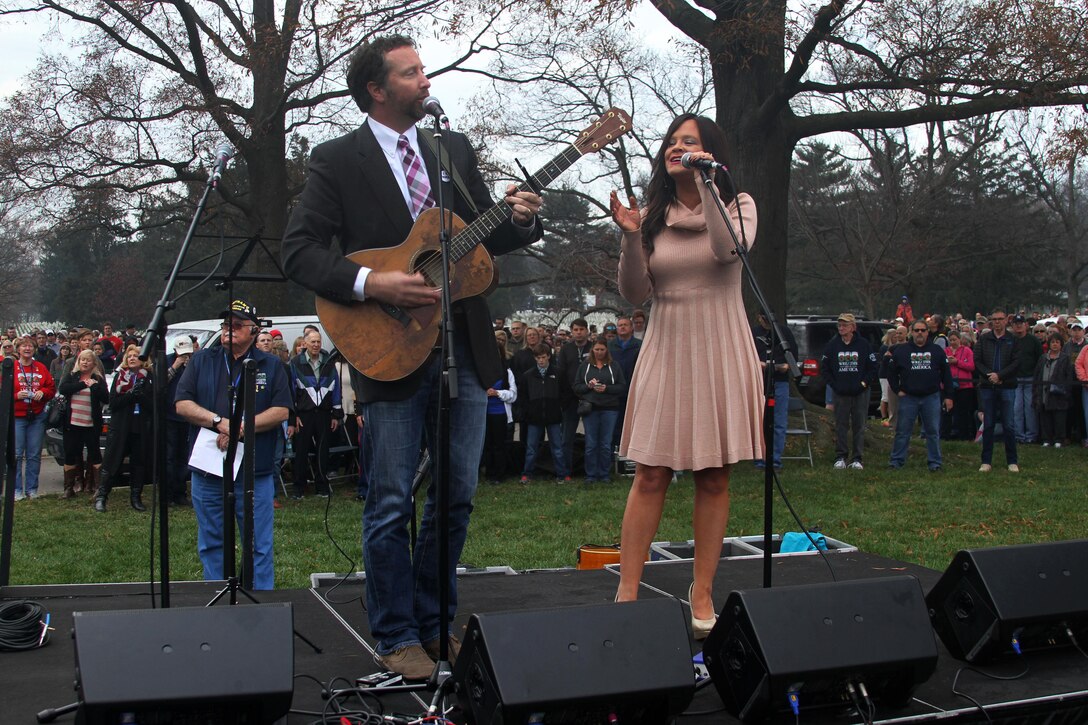 Country and Western singer Lindsay Lawler, right, and guitarist Chris Roberts sing "God Bless America" during the opening ceremony for the annual Wreaths Across America event at Arlington National Cemetery in Arlington, Va., Dec. 12, 2015. DoD photo by Sebastian Sciotti Jr.
