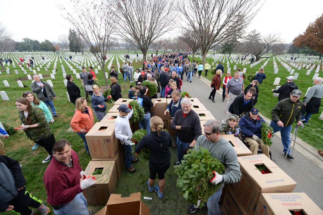 Volunteers unload a truck of wreaths during the annual Wreaths Across America event at Arlington National Cemetery in Arlington, Va., Dec. 12, 2015. DoD photo by Sebastian Sciotti Jr.
