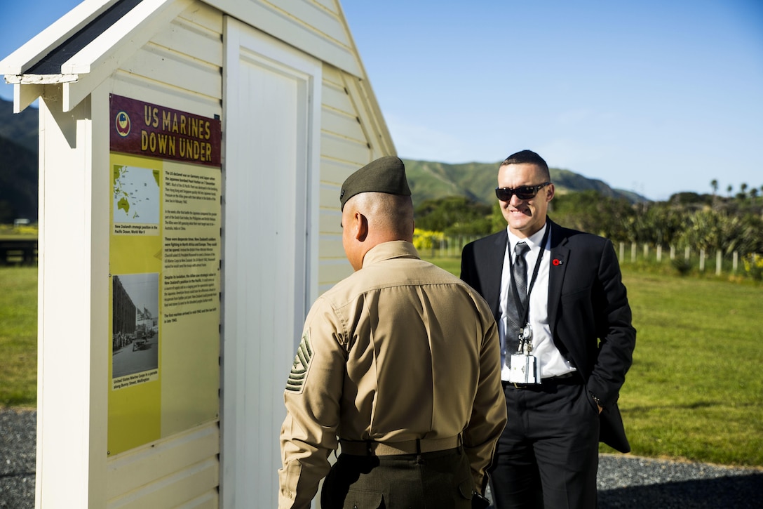 Lt Col. John W. Black takes time, Nov. 19, 2015, to show Sgt. Maj. Vincent C. Santiago the old living quarters, nearby Wellington, New Zealand, where the Marines of 1st Marine Division stayed during World War II. Santiago, from Merizo, Guam, is the sergeant major for 3rd Marine Division, III Marine Expeditionary Force. Black, from Stockton, California, works at the U.S. embassy in New Zealand. (U.S. Marine Corps photo by Cpl. Tyler S. Giguere/Released)
