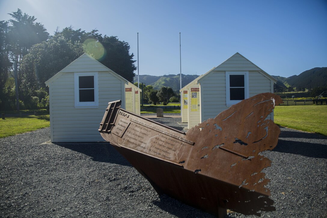 A memorial to Sailors and Marines who lost their lives during World War II stands at a site near Wellington, New Zealand, near the old living quarters of 1st Marine Division. Sgt. Maj. Vincent C. Santiago, from Merizo, Guam, was shown the site by Lt. Col. John W. Black, from Stockton California, Nov. 19, 2015. Santiago, from Merizo, Guam, is the sergeant major for 3rd Marine Division, III Marine Expeditionary Force. Black works at the U.S. embassy in New Zealand. (U.S. Marine Corps photo by Cpl. Tyler S. Giguere/Released)