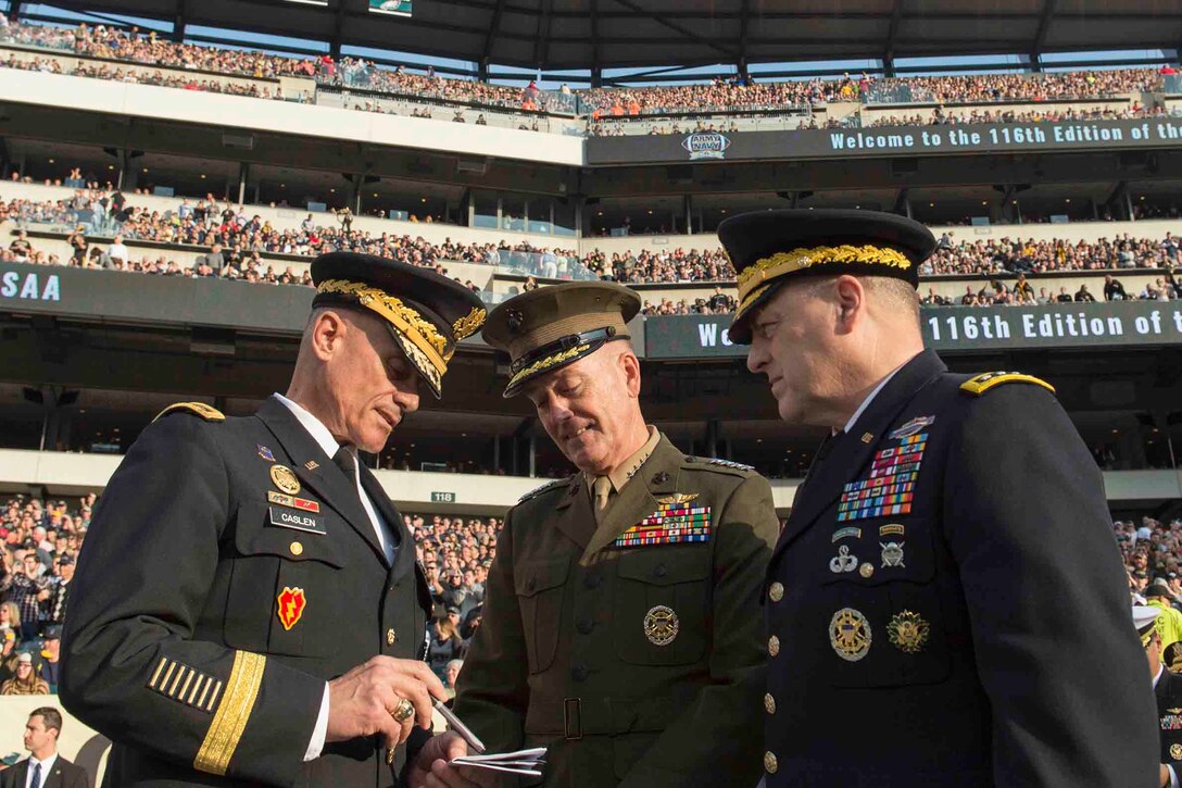 Marine Corps Gen. Joseph F. Dunford Jr., center, chairman of the Joint Chiefs of Staff, speaks with Army Chief of Staff Gen. Mark A. Milley, right, and U.S. Military Academy Superintendent Army Lt. Gen. Robert Caslen during the 116th Army-Navy game at Lincoln Financial Field in Philadelphia, Dec. 12, 2015. Navy beat Army for the 14th consecutive year, 21-17. DoD photo by Navy Petty Officer 2nd Class Dominique A. Pineiro