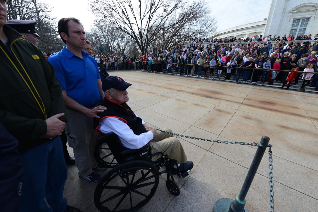 Arthur Best, right, a World War II veteran, family members and Kevin Haley, a police officer from Portland, Maine, watch as a wreath is placed at the Tomb of the Unknown Soldier at Arlington National Cemetery in Arlington, Va., Dec. 12, 2015. DoD photo by Sebastian Sciotti Jr.