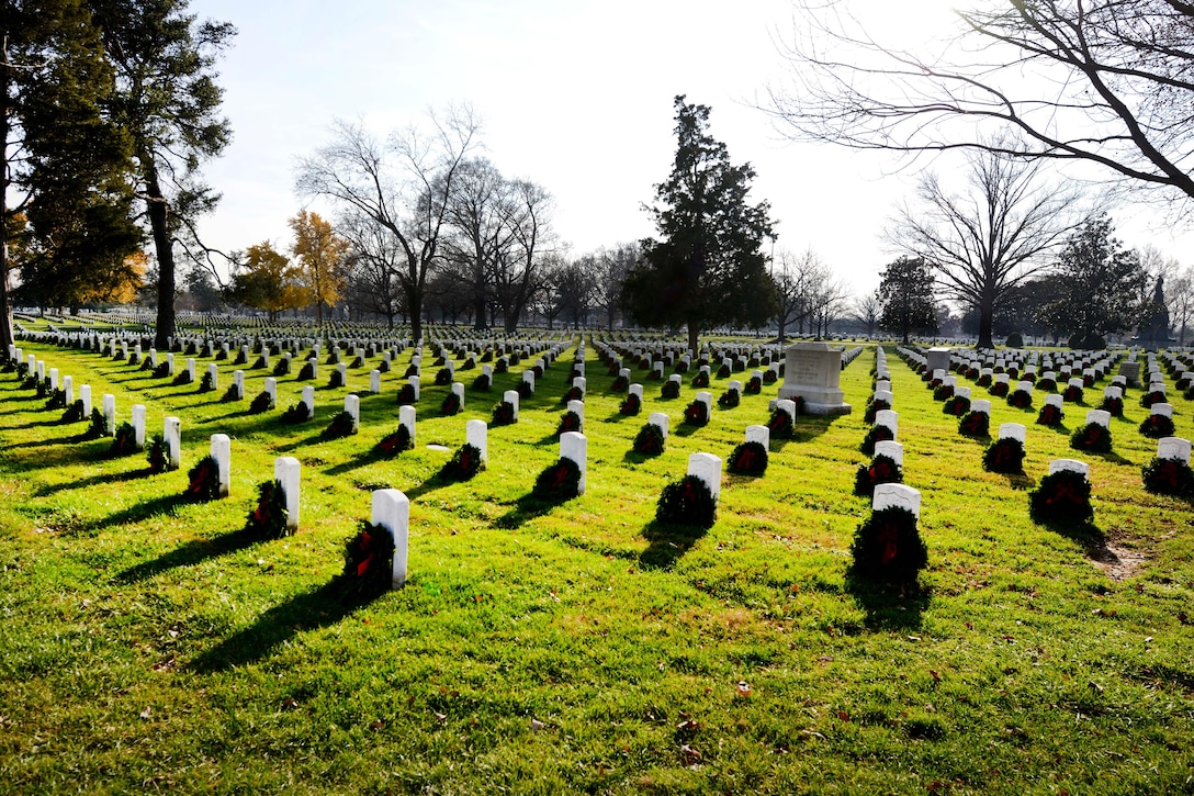 Wreaths adorn headstones placed by thousands of volunteers following the annual Wreaths Across America event in Arlington National Cemetery, Arlington, Va., Dec. 12, 2015. DoD photo by Sebastian Sciotti Jr.