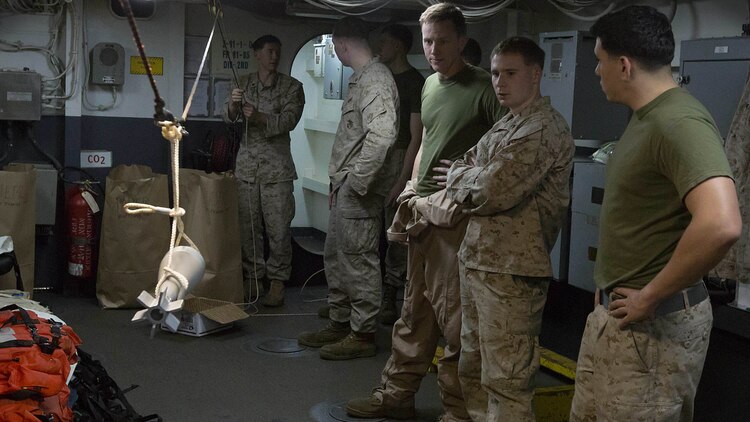 U.S. Marine Sgt. Peter A. Lawson, an explosive ordnance disposal technician with Combat Logistics Battalion 26, 26th Marine Expeditionary Unit, uses an EOD hook and line kit to maneuver an inert 82mm mortar shell replica during an EOD demonstration aboard the amphibious assault ship USS Kearsarge in the Arabian Gulf Dec. 12, 2015. The EOD exploration event afforded Marines in other occupations the opportunity to learn about the equipment and responsibilities of EOD Marines. The 26th MEU is embarked on the Kearsarge Amphibious Ready Group and is deployed to maintain regional security in the U.S. 5th Fleet area of operations. 