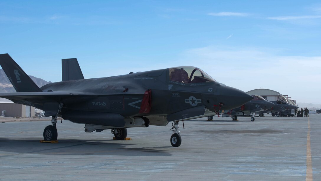 F-35B Lightning II aircrafts stands ready for flight operations during Exercise Steel Knight at Marine Corps Air Ground Combat Center Twentynine Palms, California, Dec. 10, 2015. The F-35B is a single seat, single engine stealth multi-role fighter bringing the Marine Corps into a whole new generation of aircraft. Exercise Steel Knight allowed for Marine Fighter Attack Squadron 121 and Marine Operational and Test Evaluation Squadron 22 to train on integrating the F-35B and find its place in the Marine Air Ground Task Force, while giving the ground forces of 1st Marine Division the ability to become familiar with it.