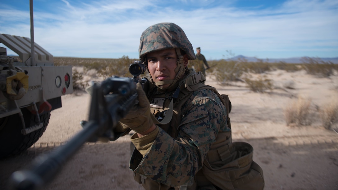 A Marine holds security during a route clearance drill as a part of Exercise Steel Knight at Marine Corps Air Ground Combat Center Twentynine Palms, California, Dec. 13, 2015. The Marine is with 1st Combat Engineer Battalion. During route clearance Marines use a variety of vehicles to search for improvised explosive devices, mines and other dangerous obstructions. Steel Knight is a 1st Marine Division led exercise, which enables the Marines and sailors to operate in a realistic environment to develop skill sets necessary to maintain a fully capable Marine Air Ground Task Force.